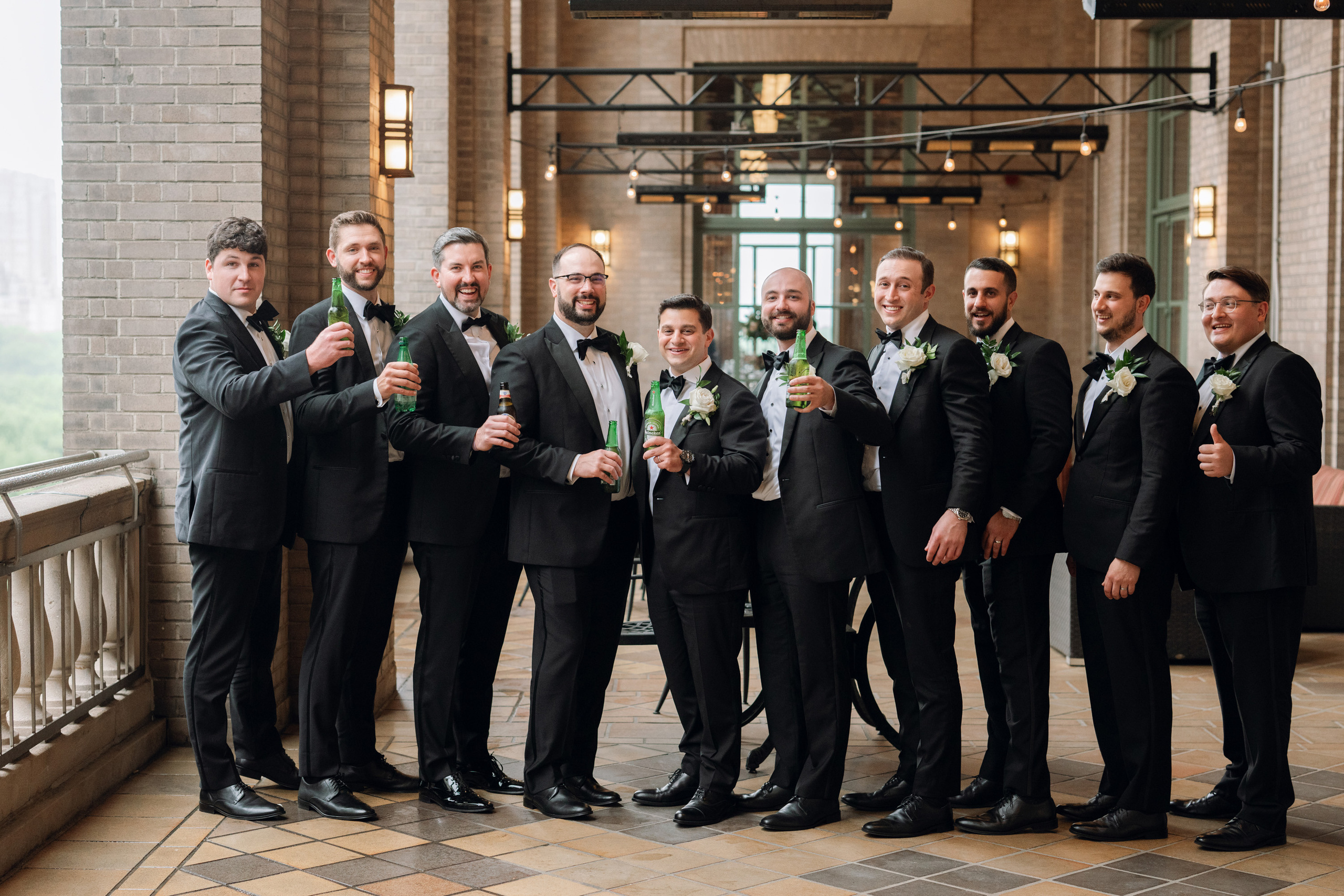 a group of men in suits and ties holding drinks