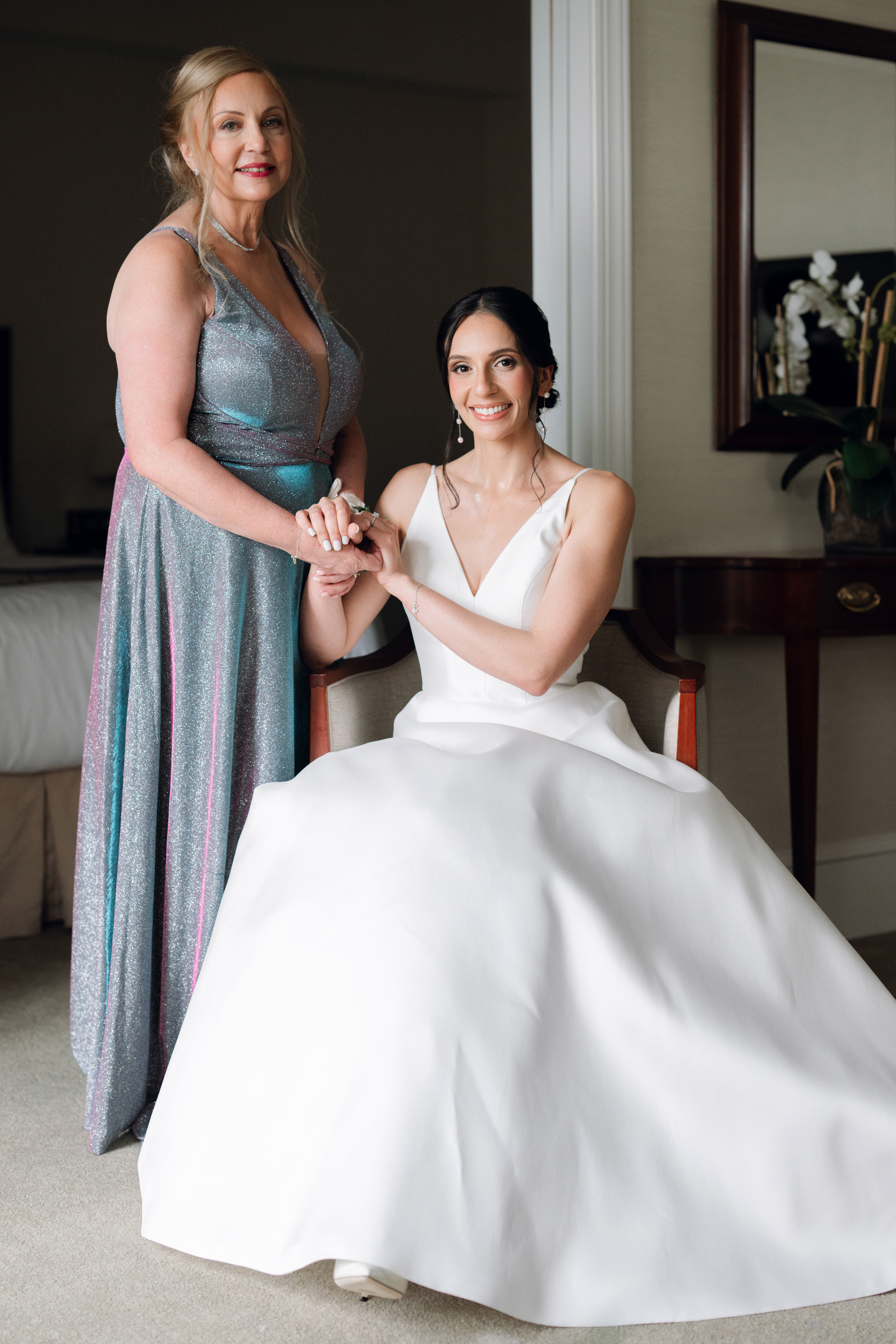 a bride and her mother in a hotel room