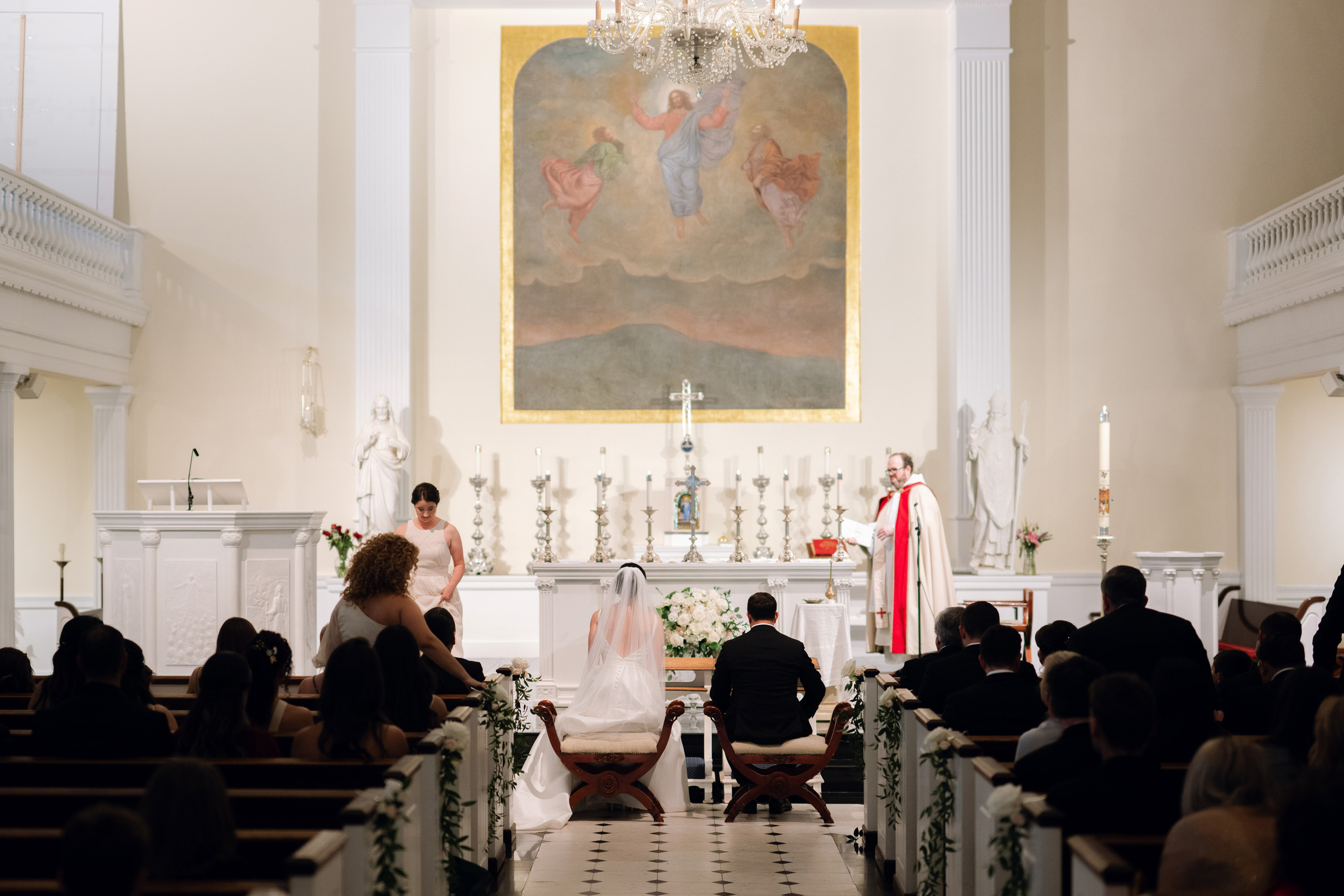 a couple is sitting in a church