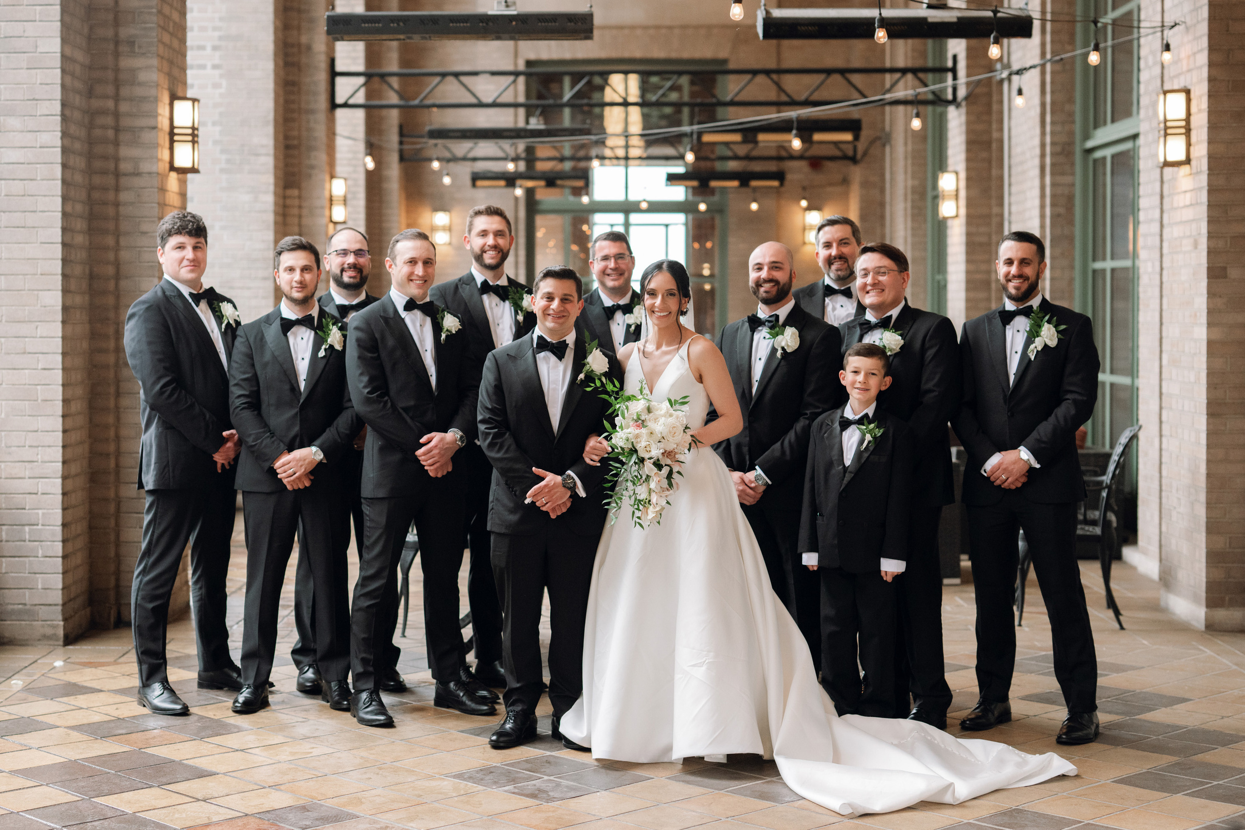 a group of people standing in a building