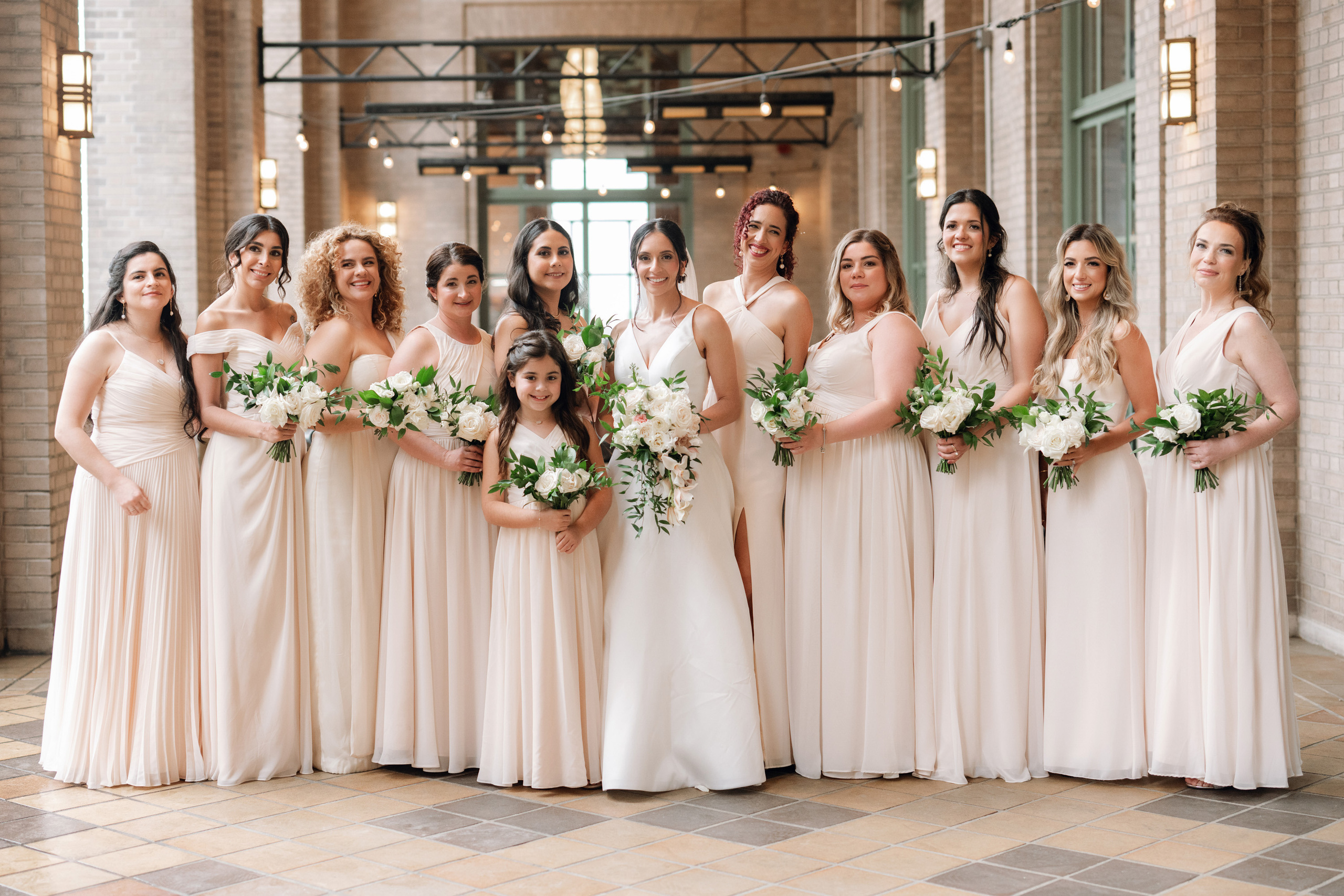 a group of bridesmaids posing for a photo