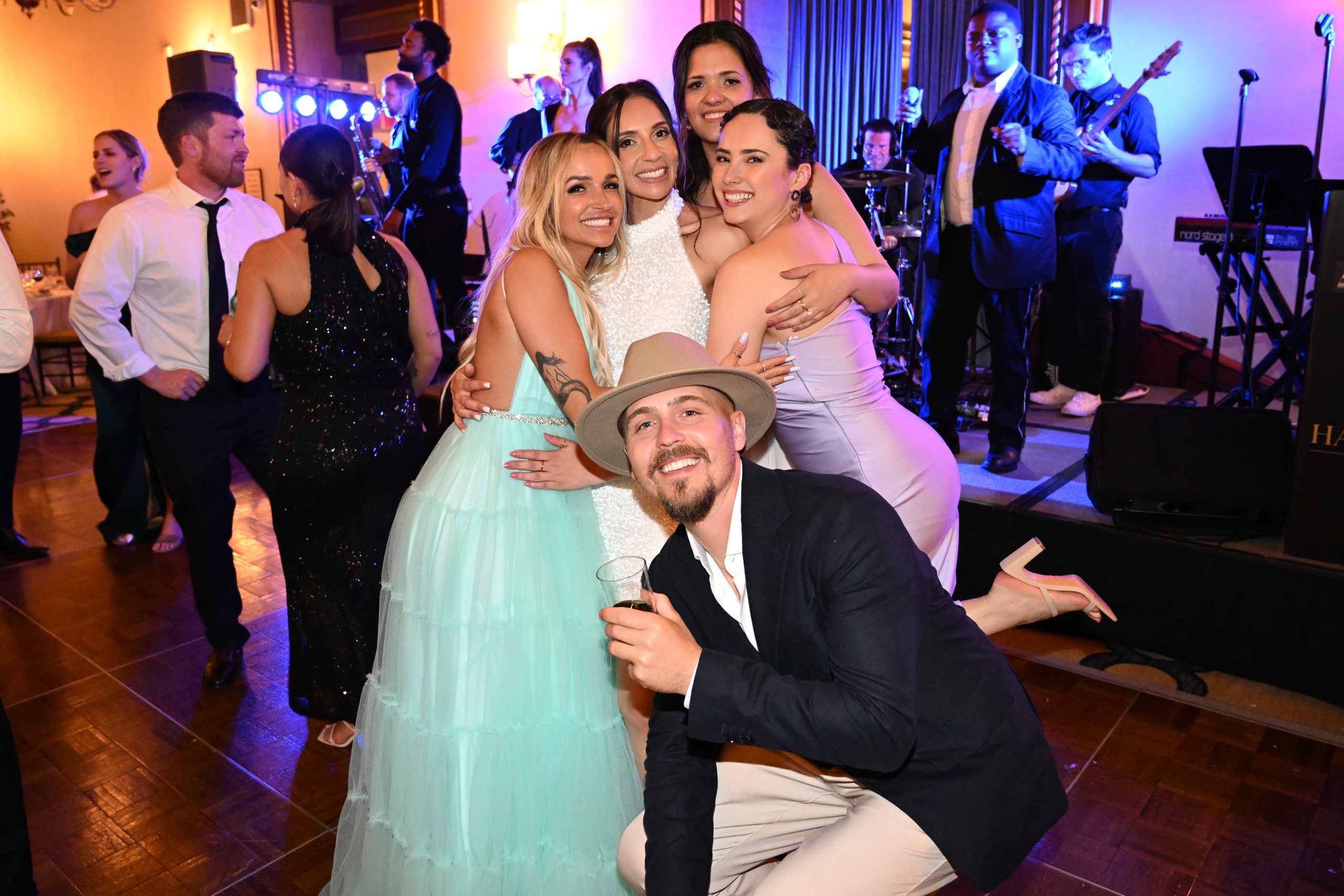 a man and woman posing for a picture on the dance floor