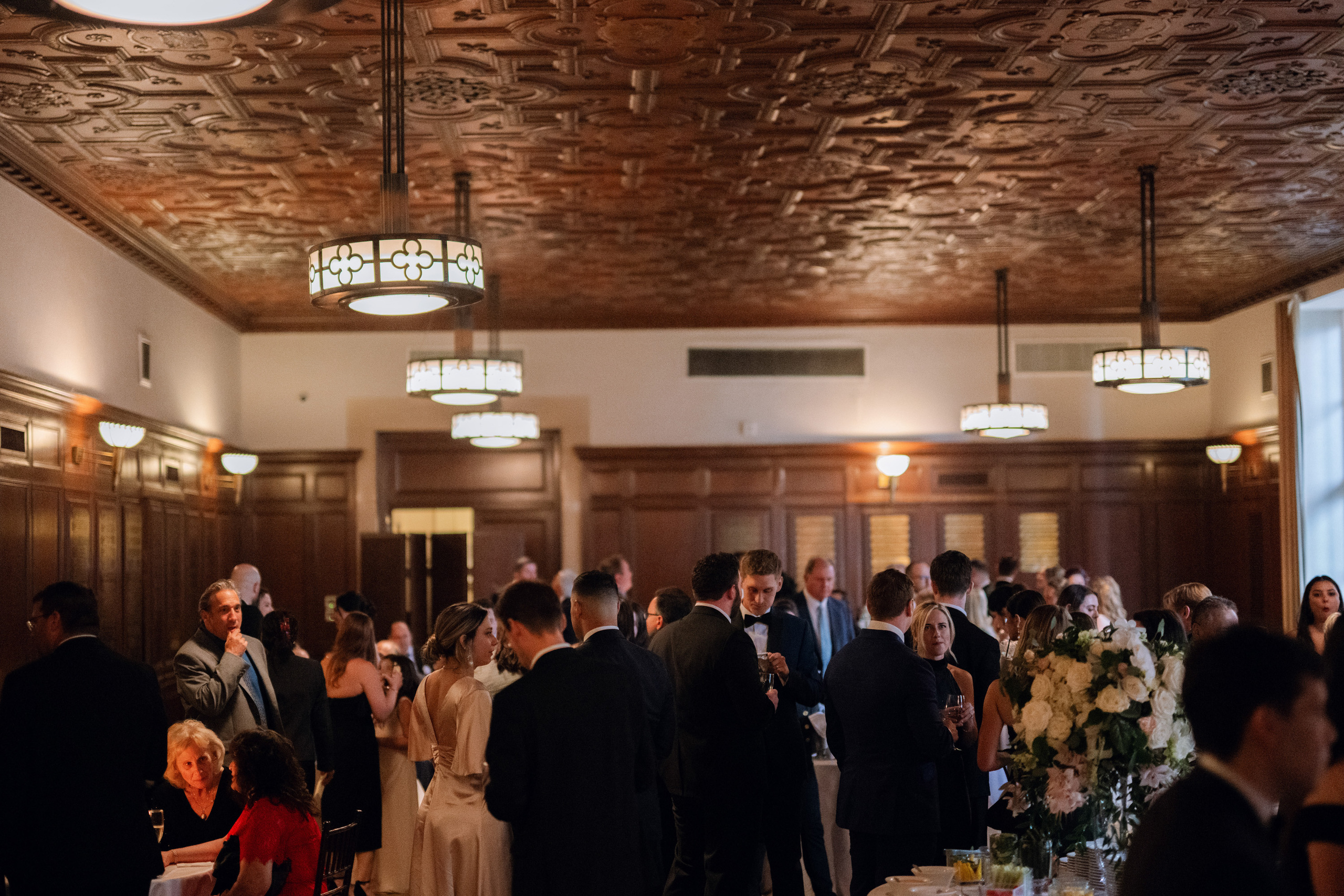 a group of people standing around a table