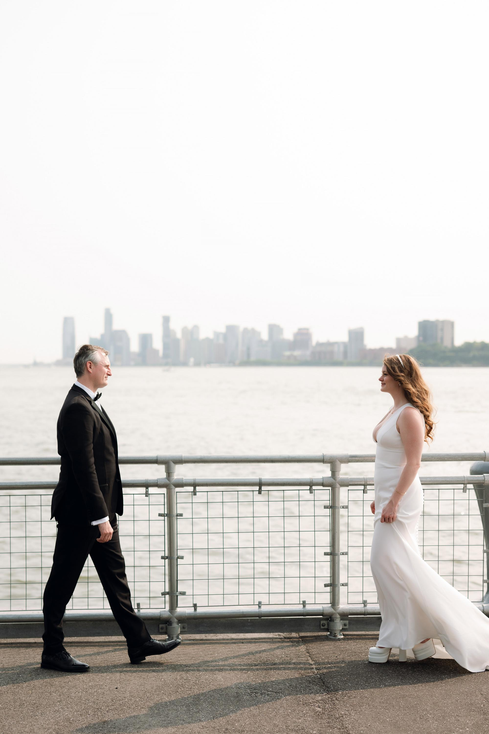 a man and woman walking on a bridge