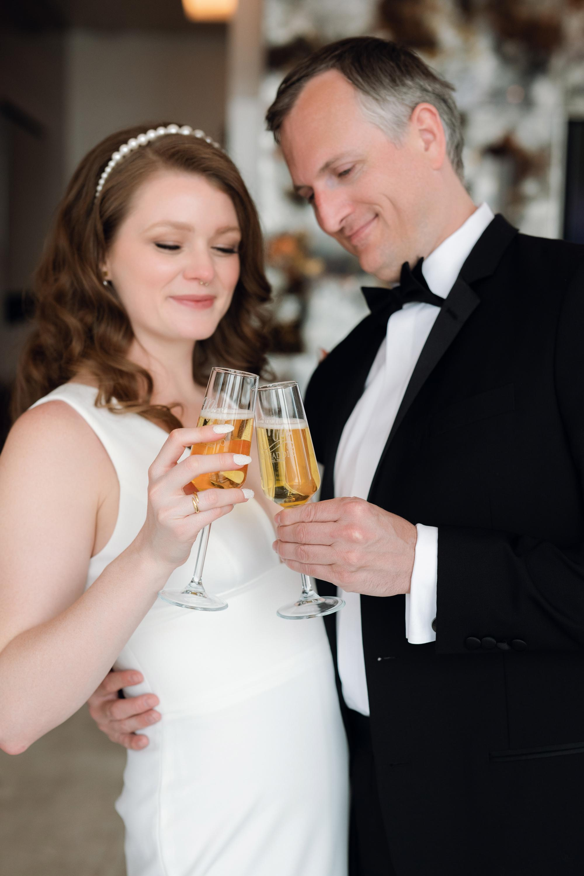 a man and woman holding glasses of champagne