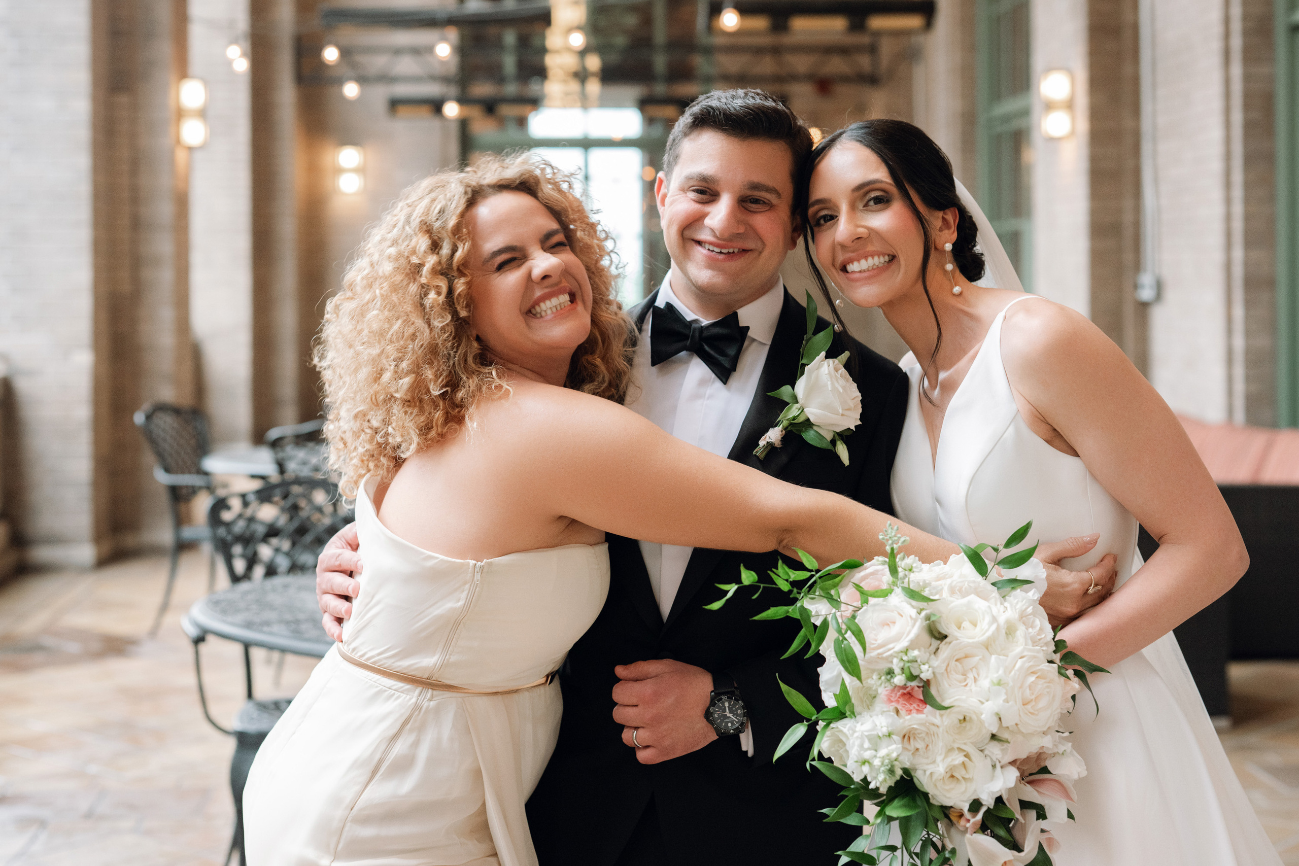 a bride and groom pose for a picture