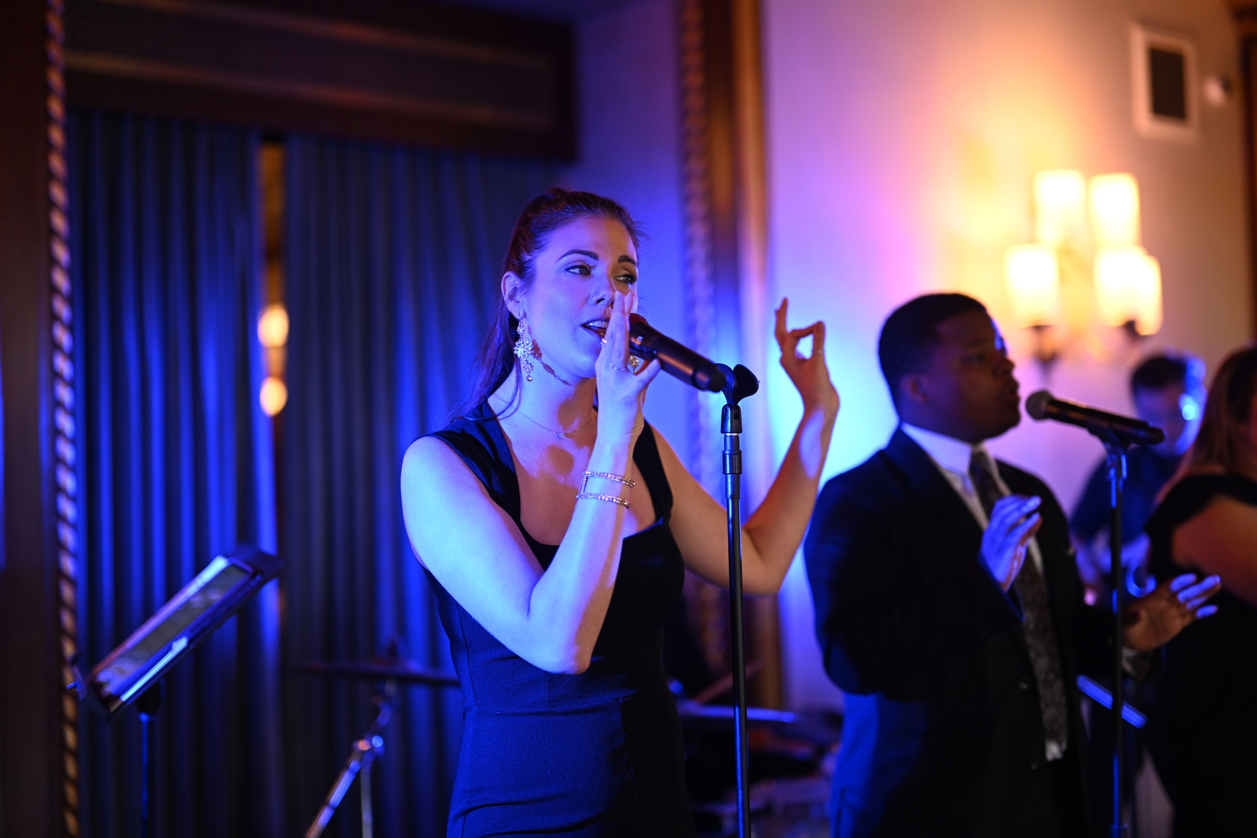 a woman singing into a microphone