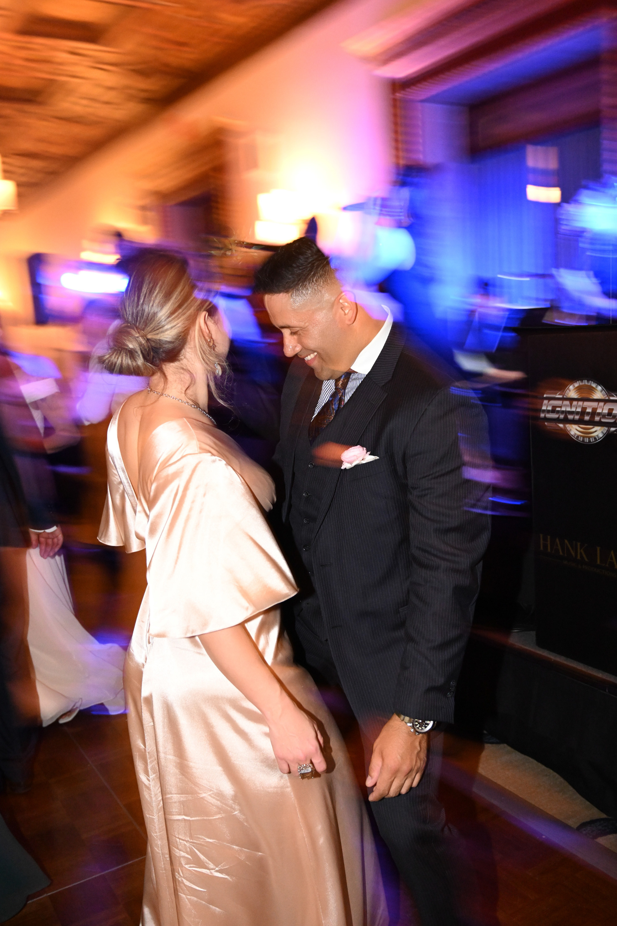 a man and woman dancing in a room