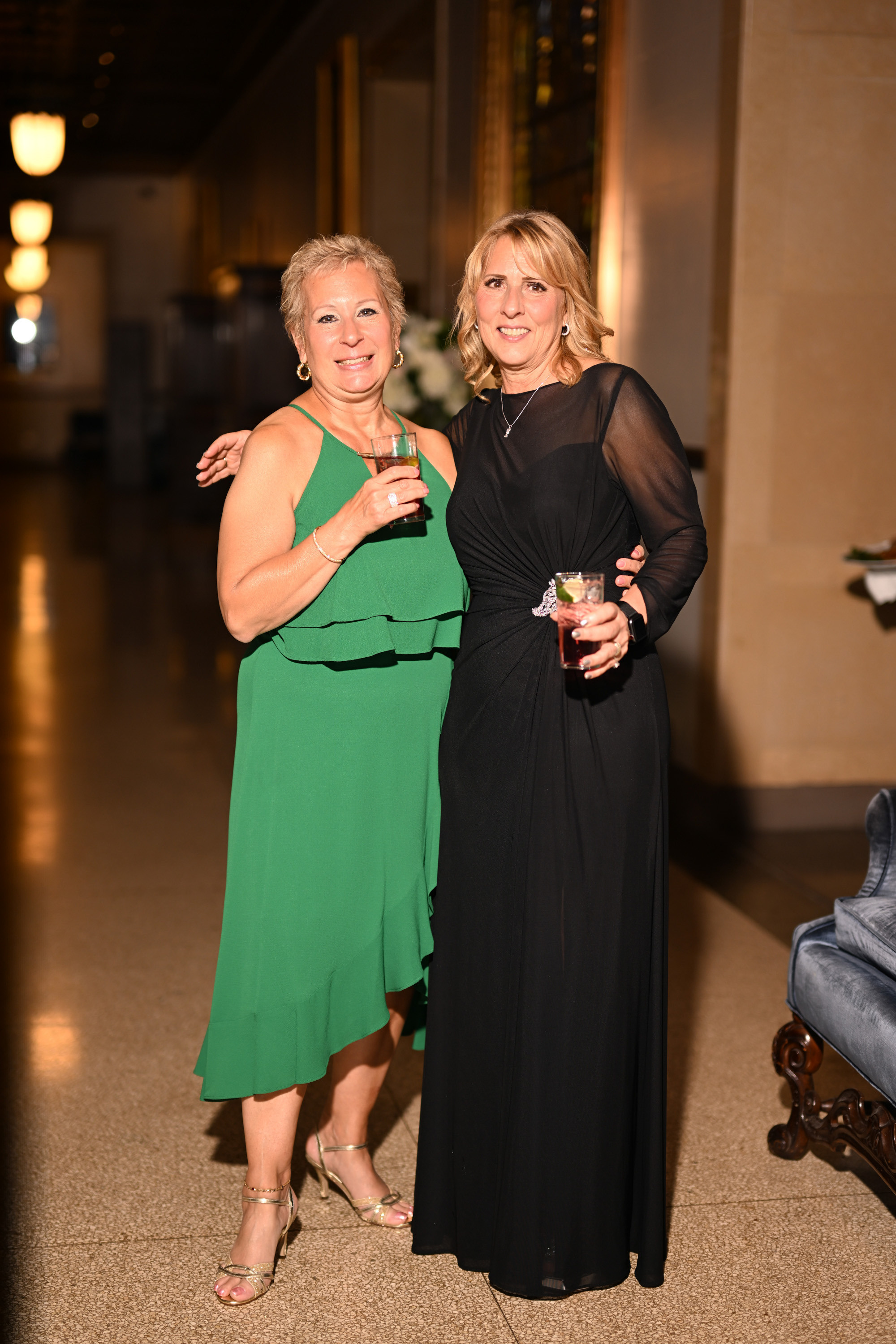 two women standing next to each other women