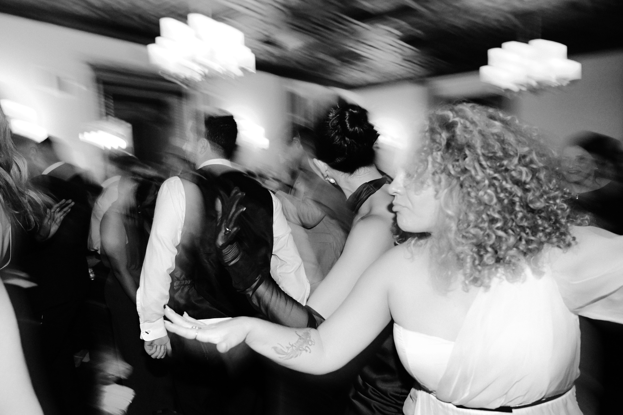 a group of people dancing at a party