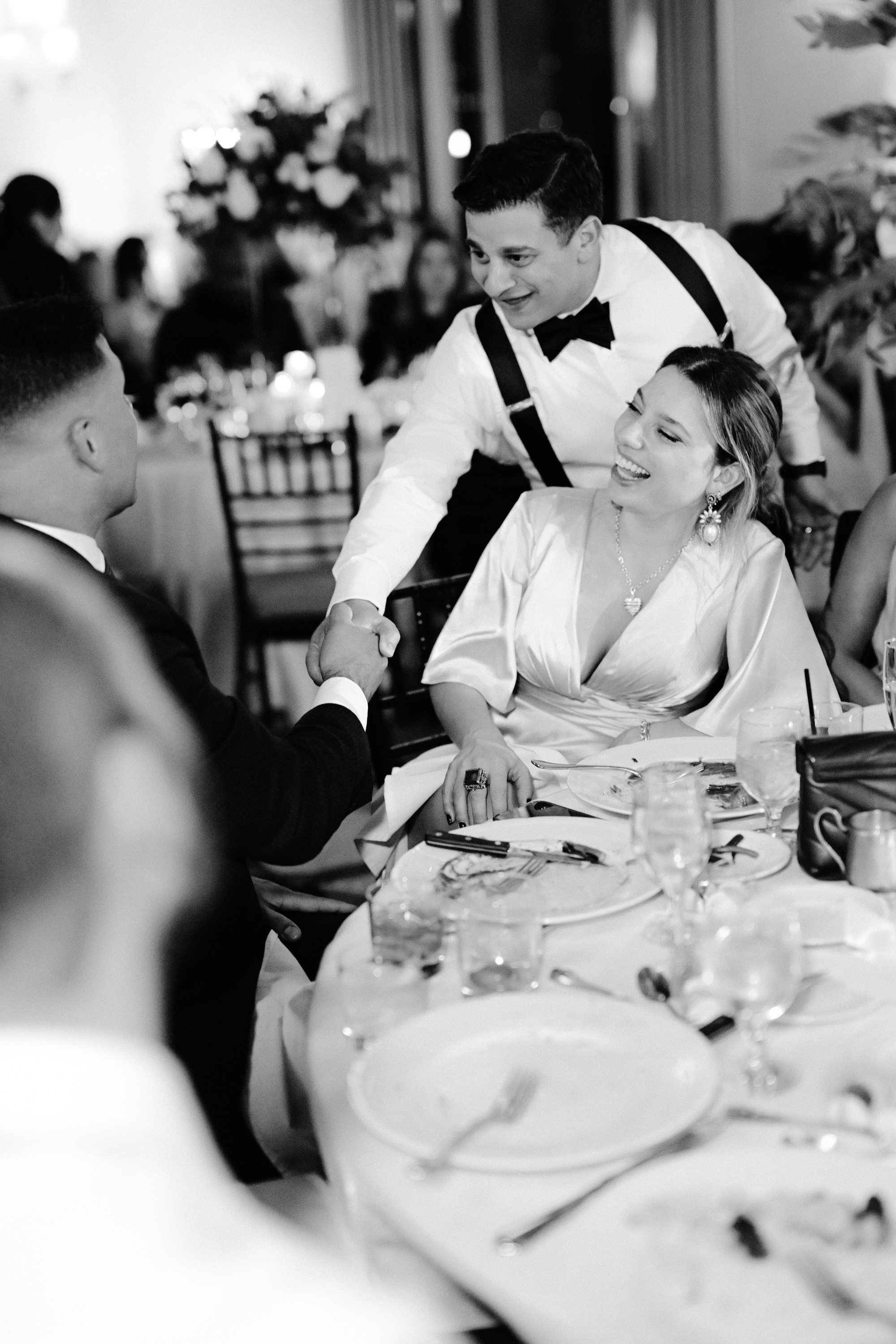 a man and woman are sitting at a table