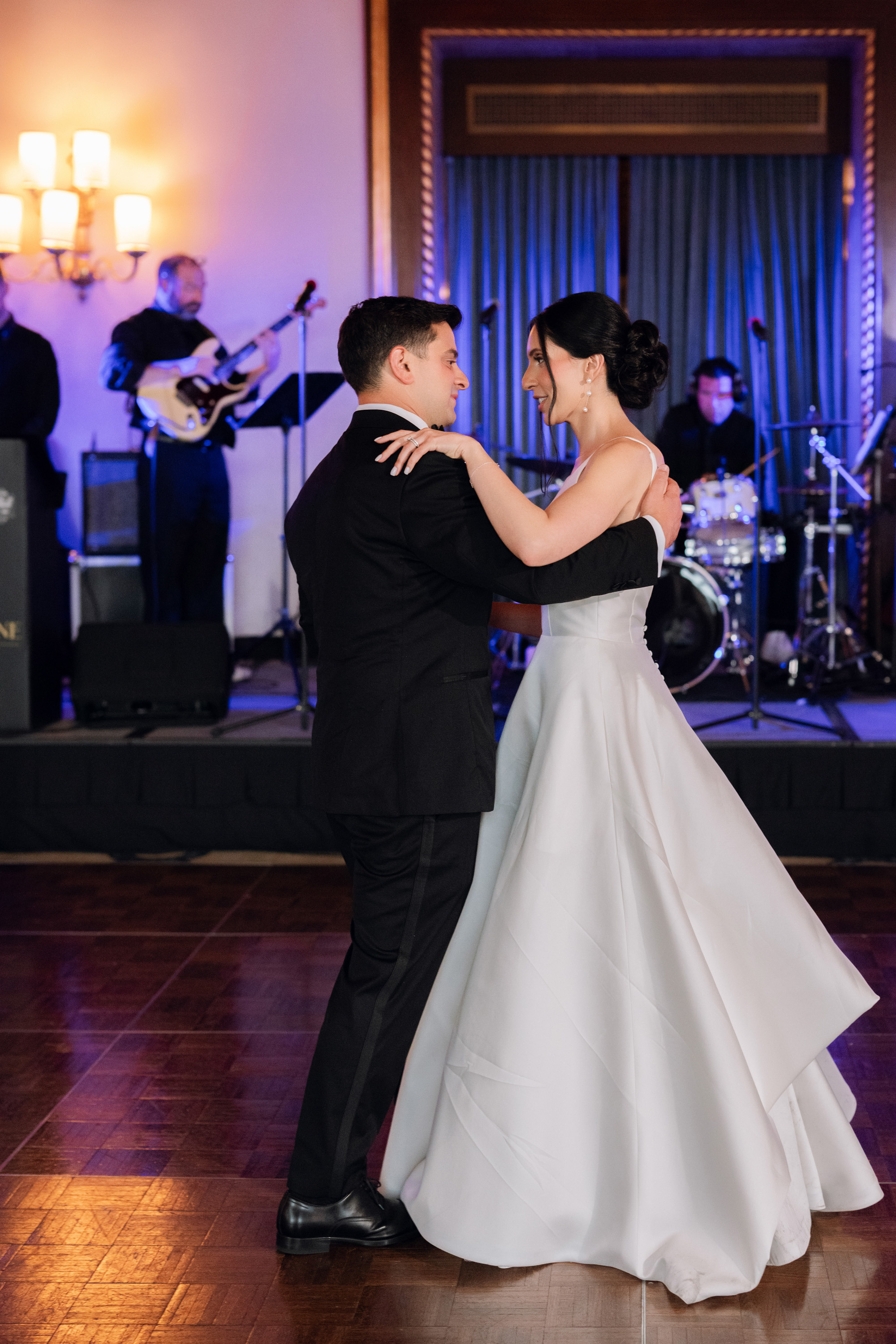 a bride and groom dance at their wedding reception