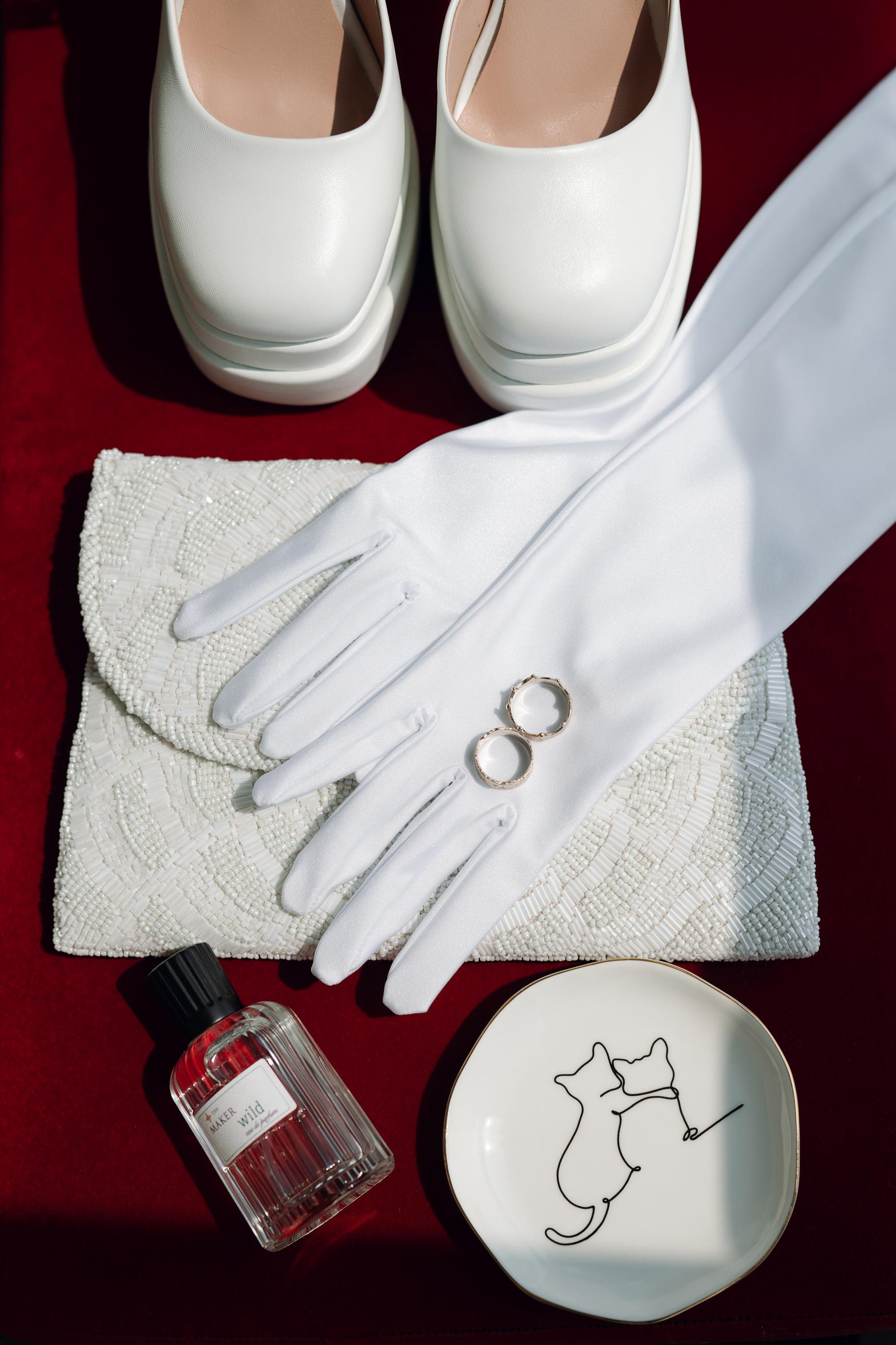 a pair of white gloves and a white plate