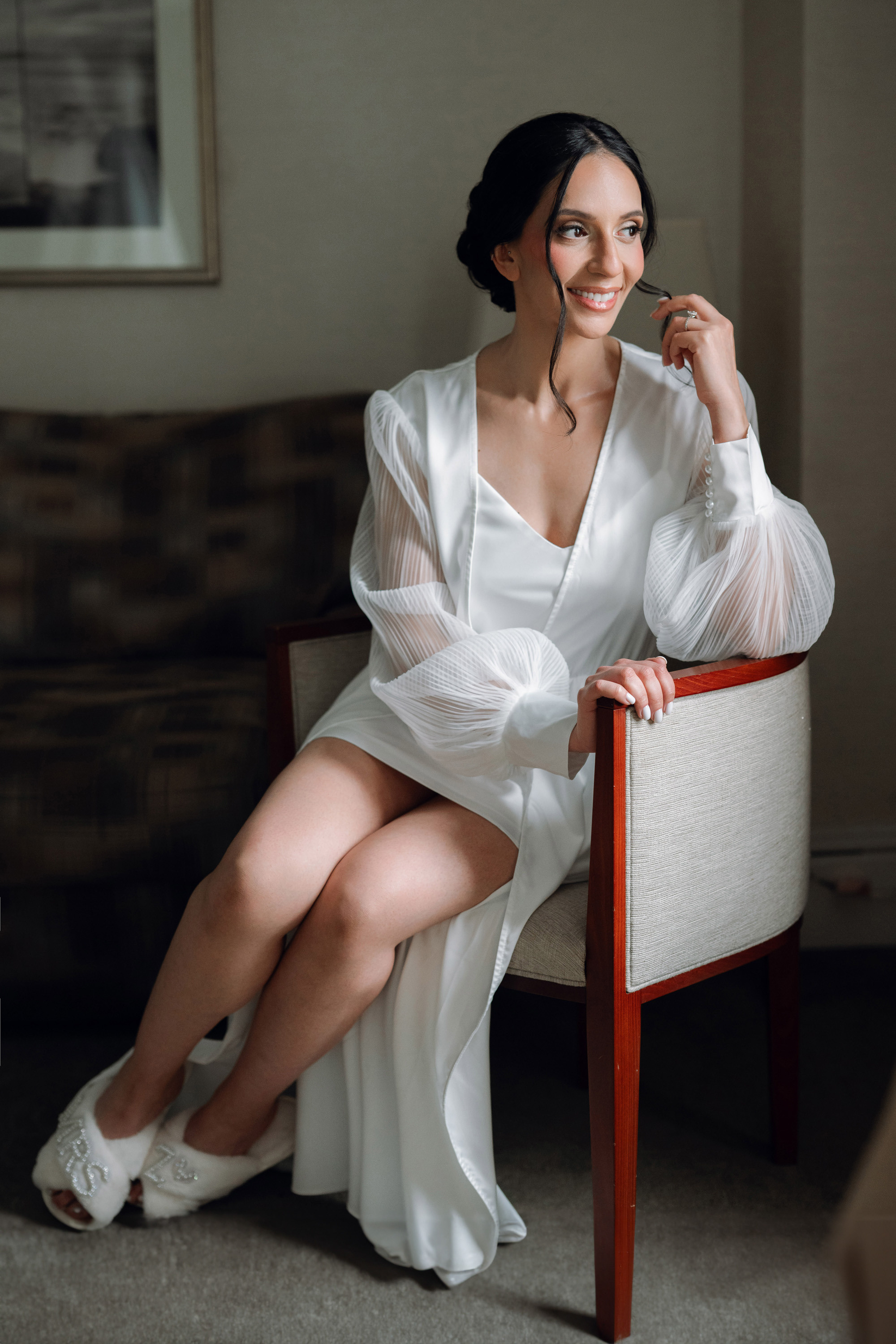 a woman sitting on a chair in a room