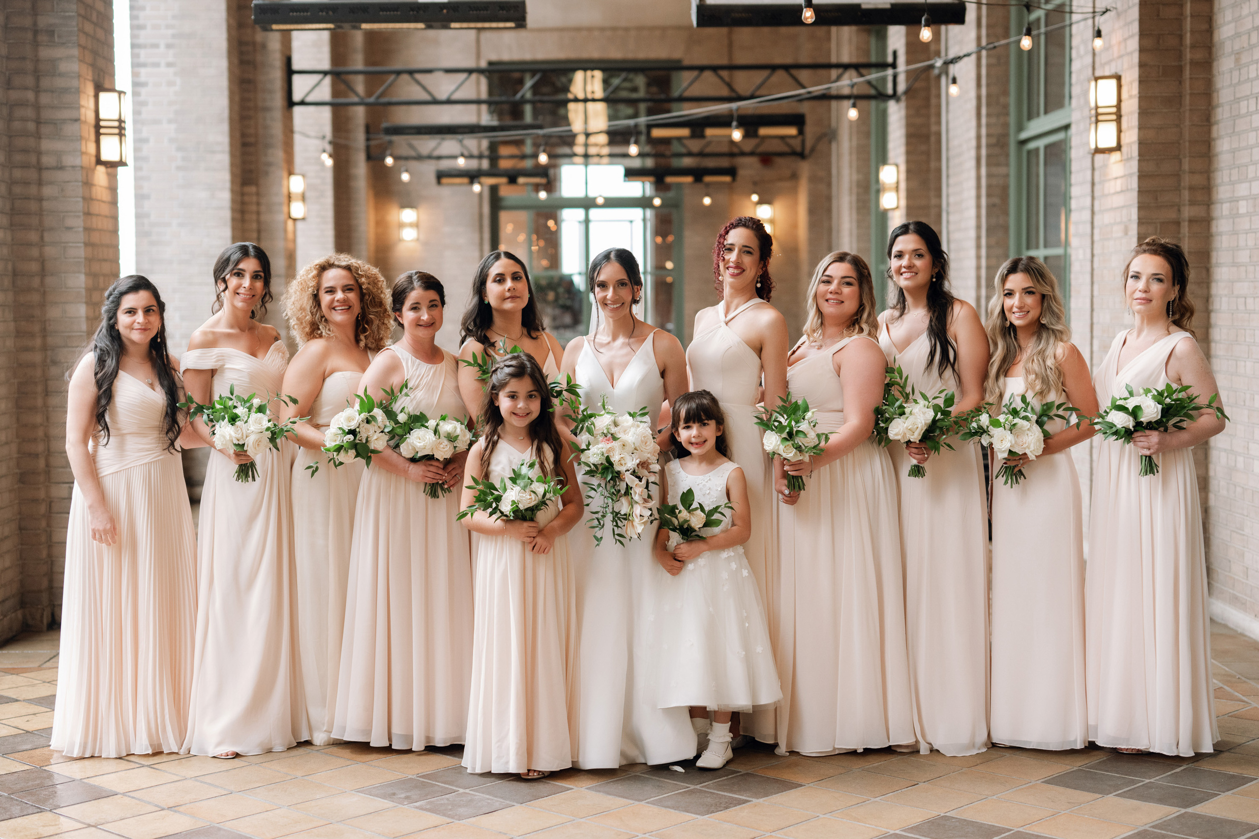 a group of bridesmaids posing for a photo