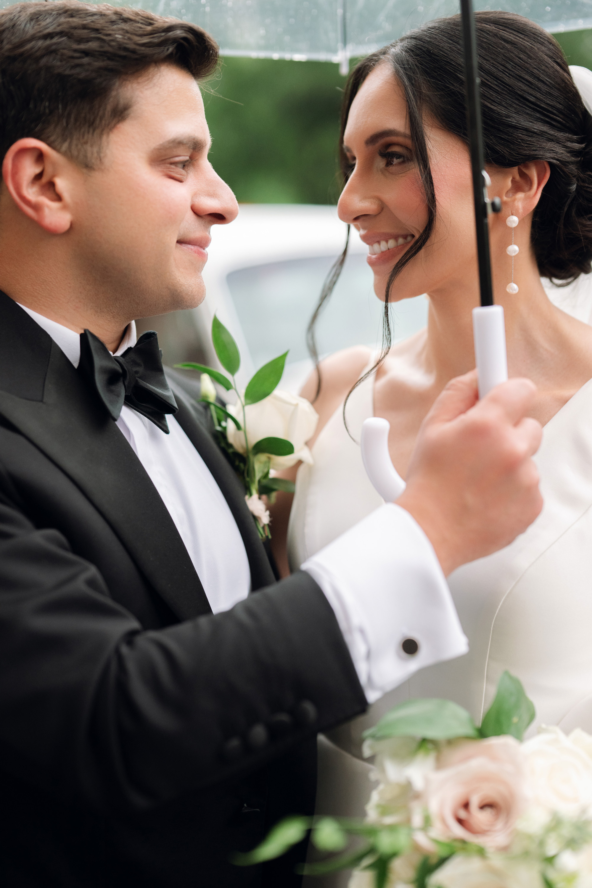 a man and woman holding an umbrella