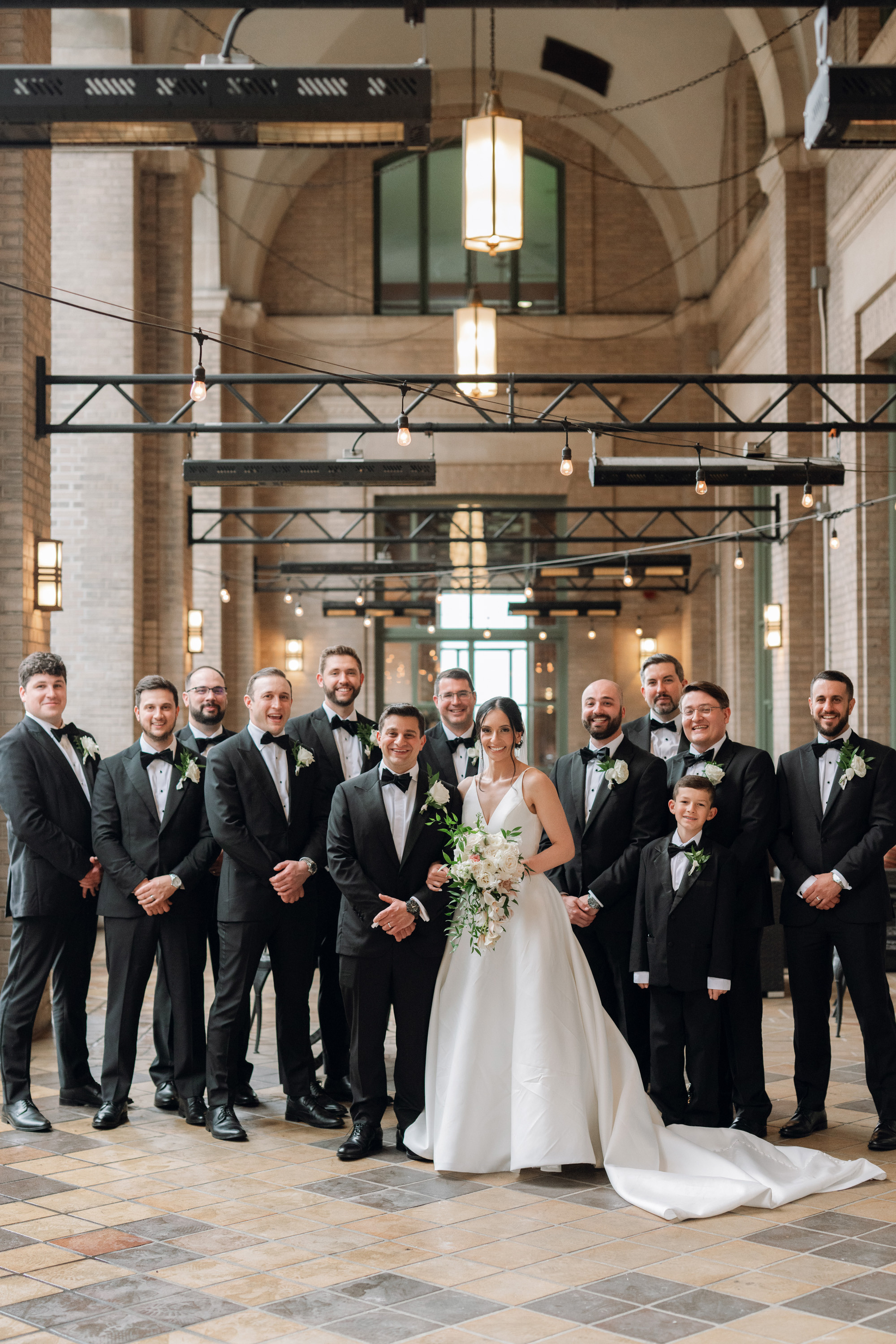 a group of people standing in a building