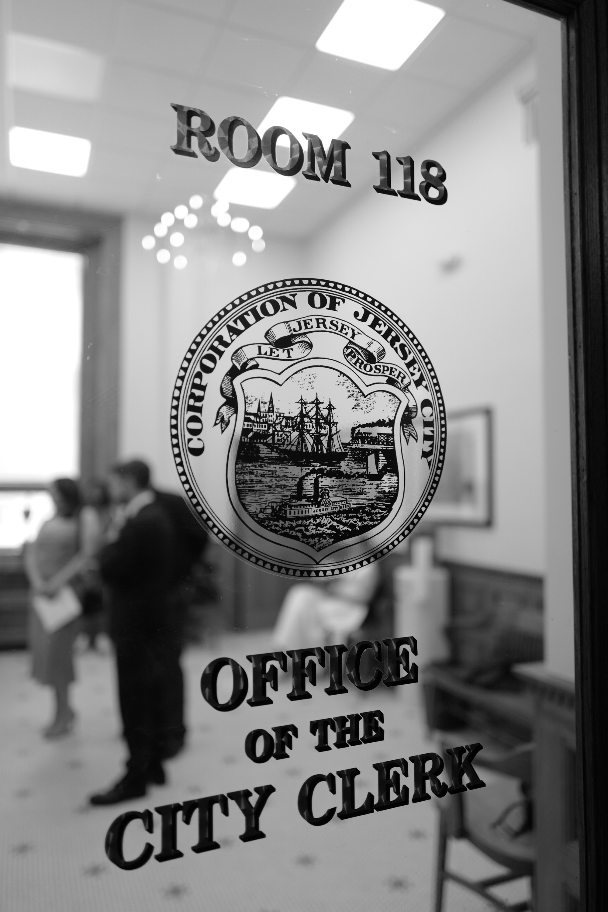 a black and white photo of a room with a sign