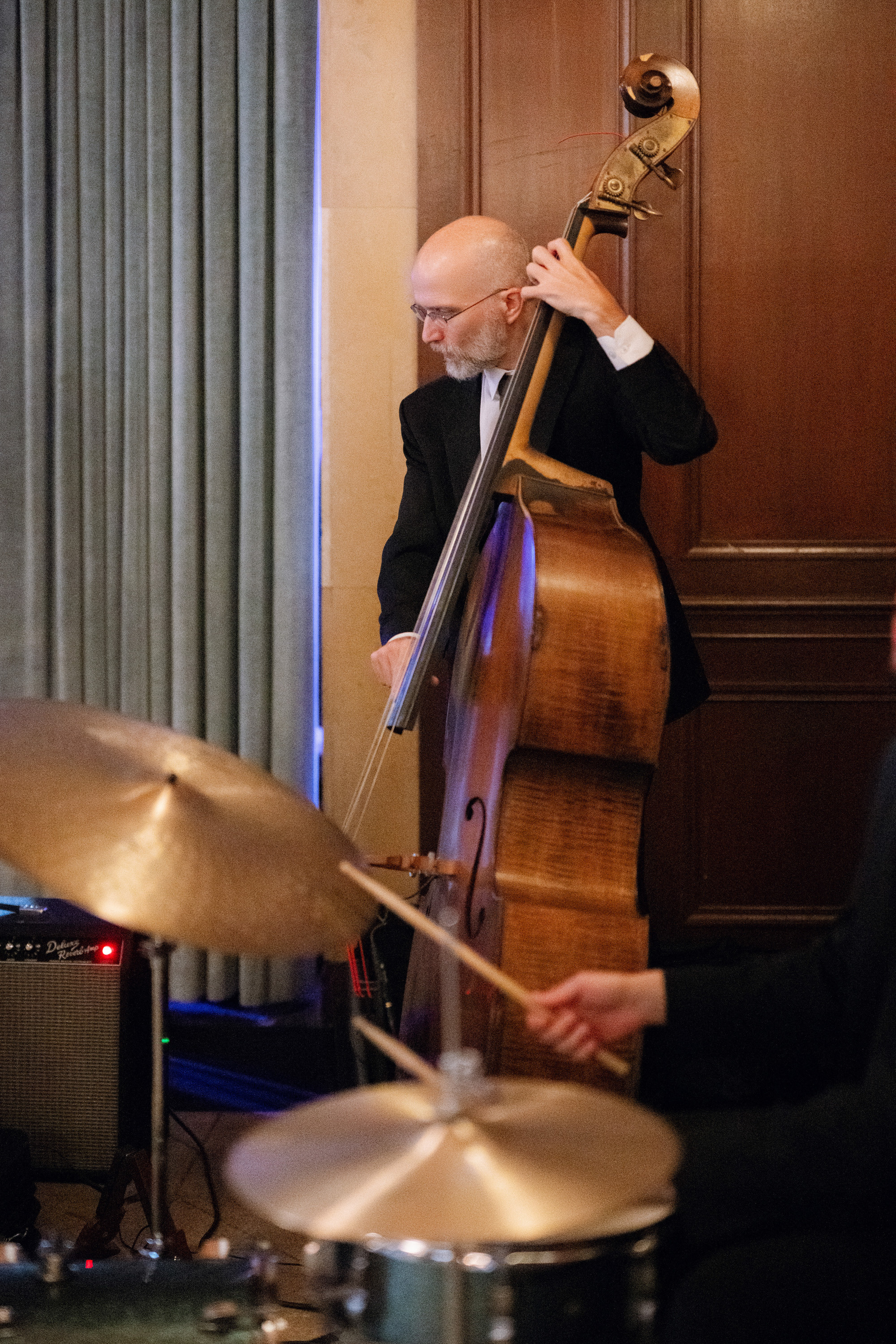 a man playing a musical instrument in a room