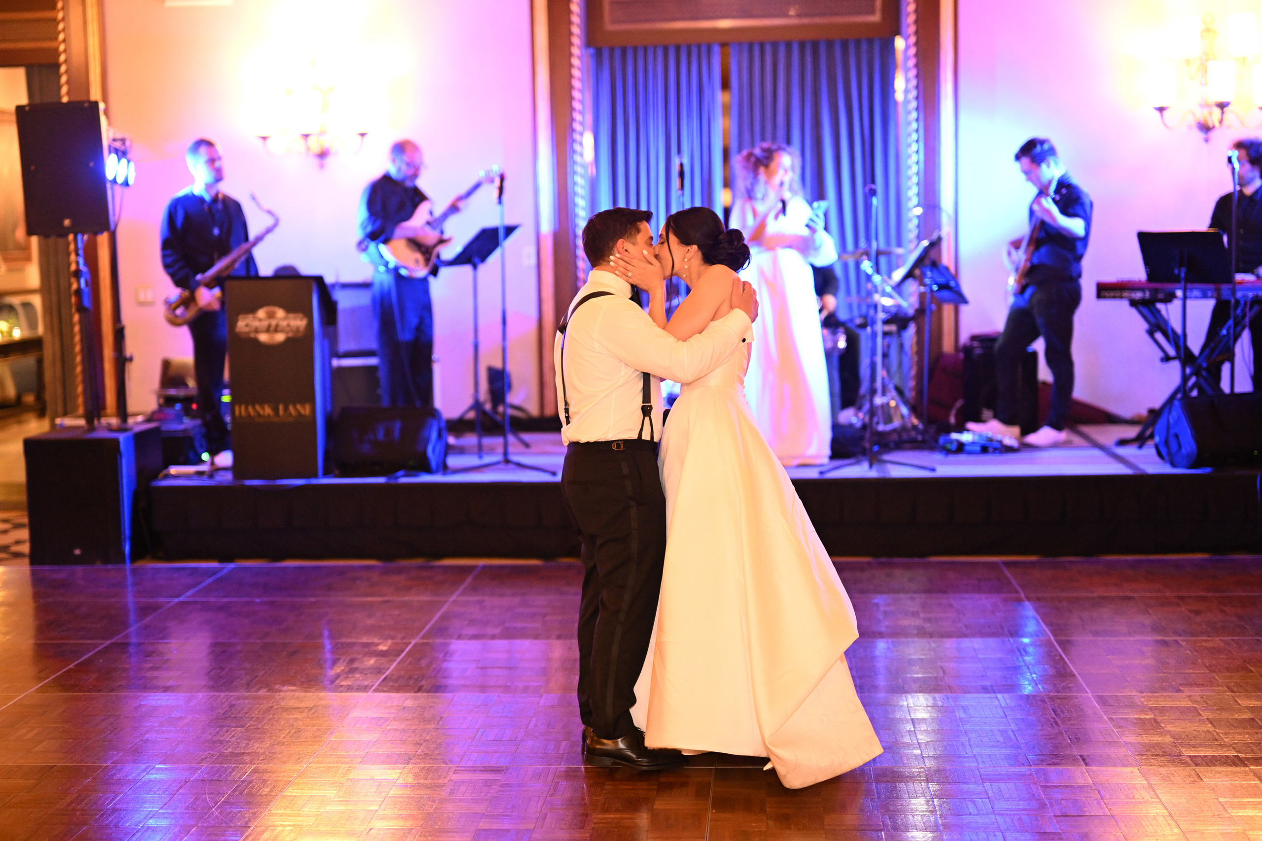 a bride and groom dance together at their wedding reception
