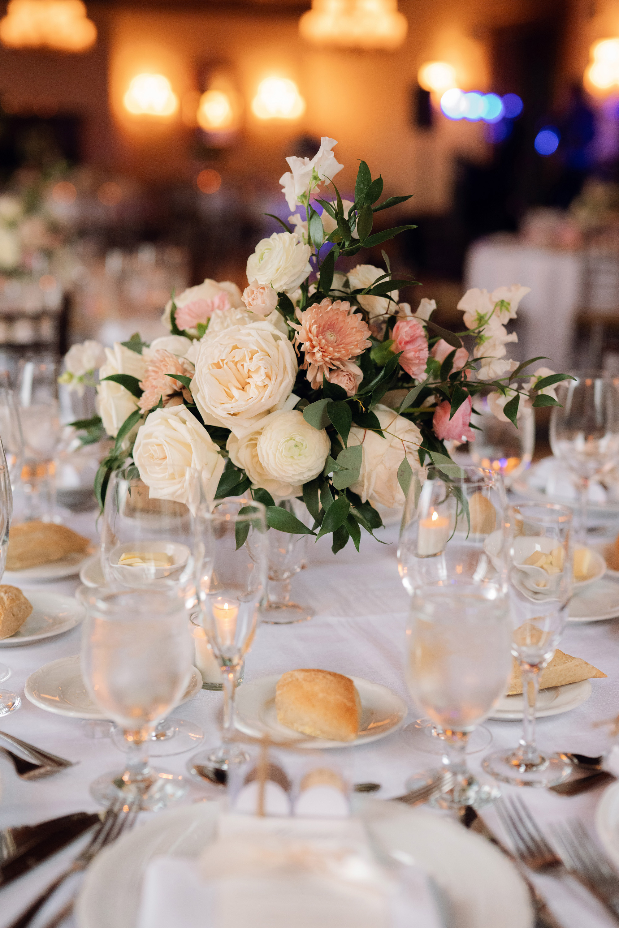 a table with a bunch of flowers and plates