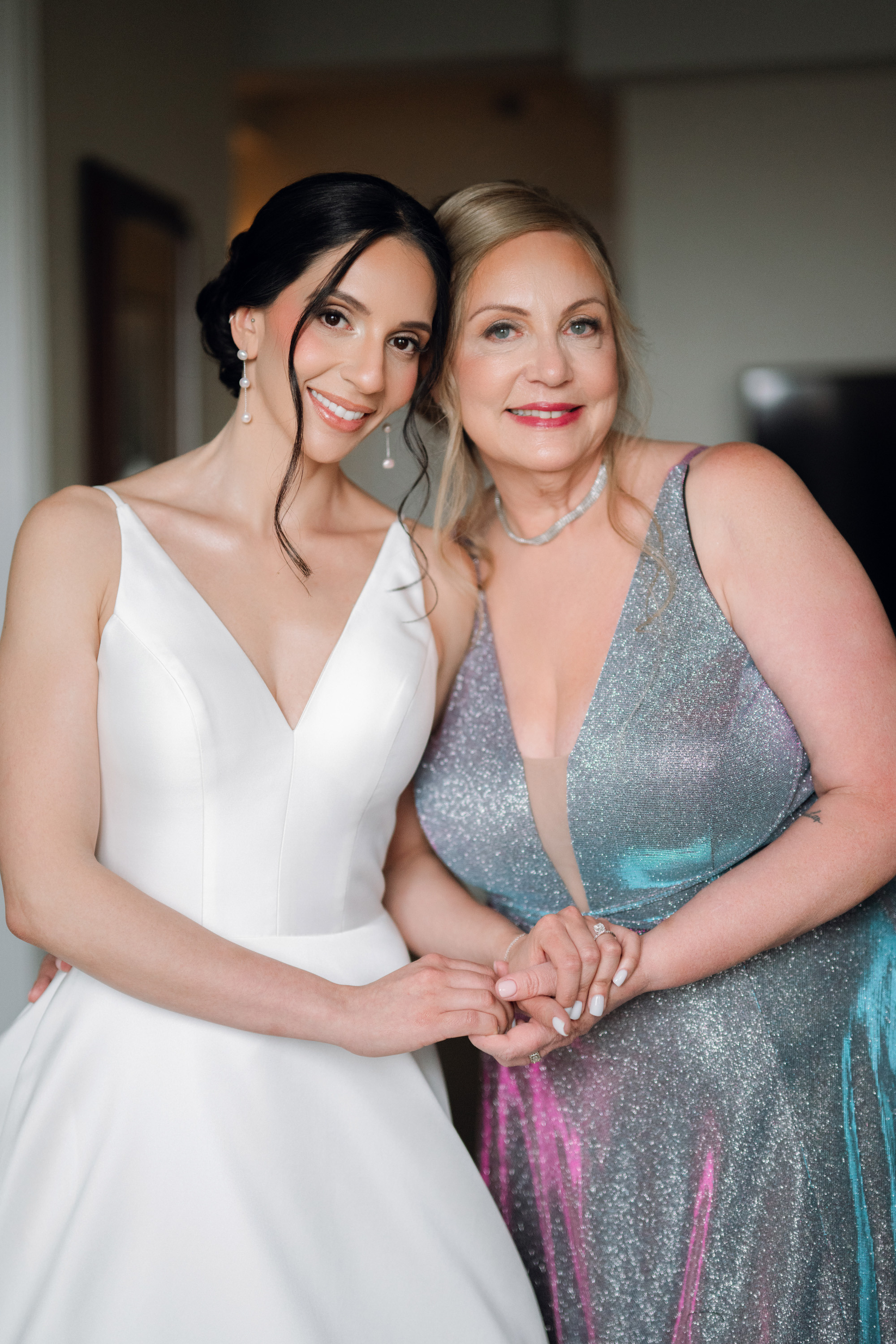two women in dresses posing for a photo