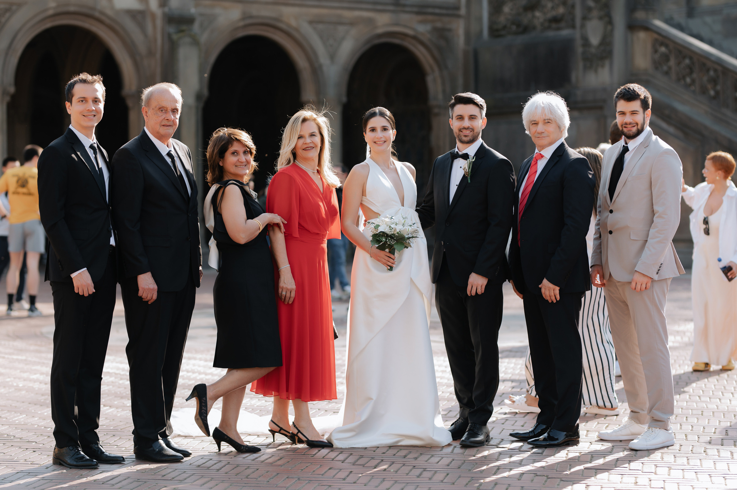 a group of people standing on a brick walkway