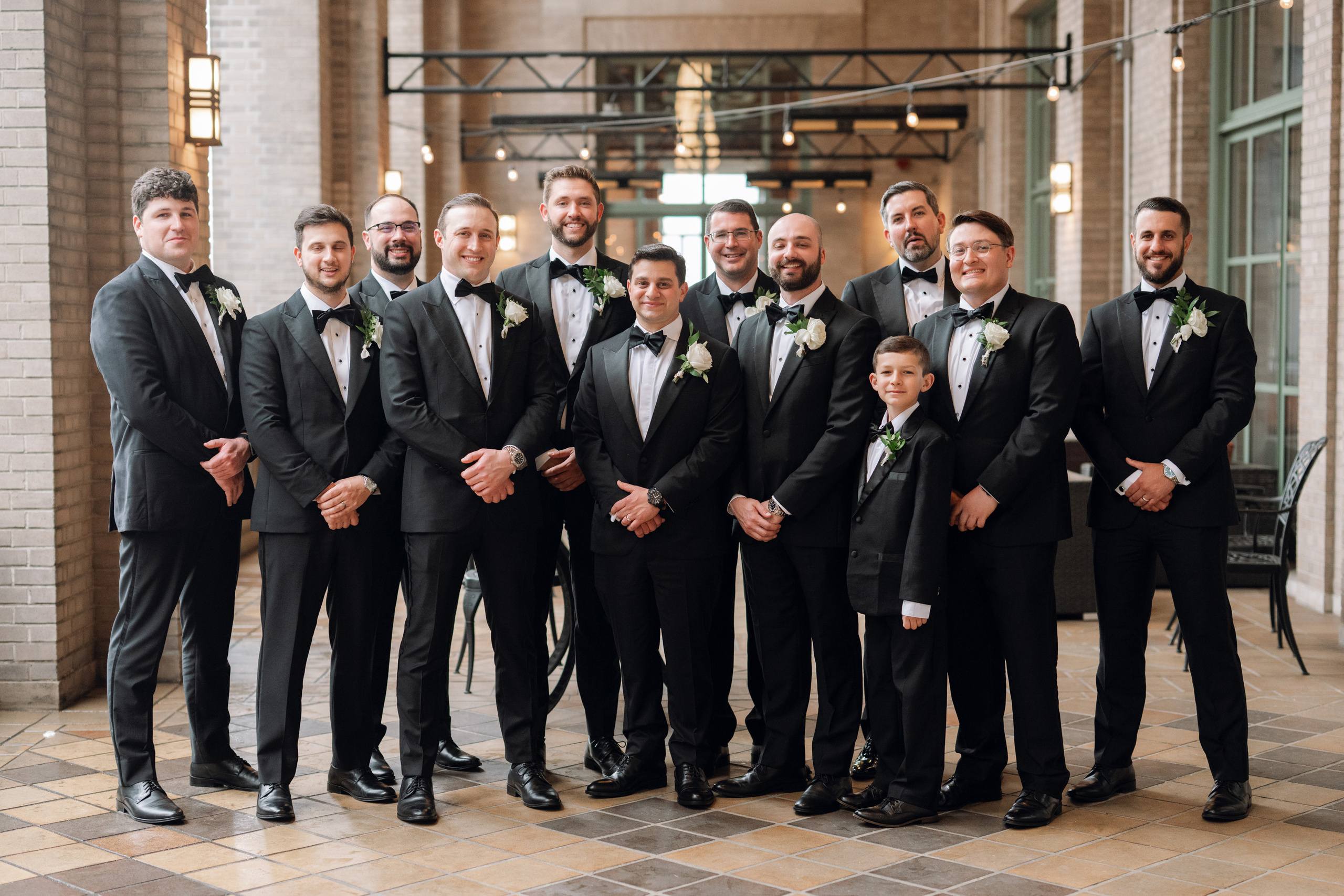 a group of men in suits and ties posing for a picture