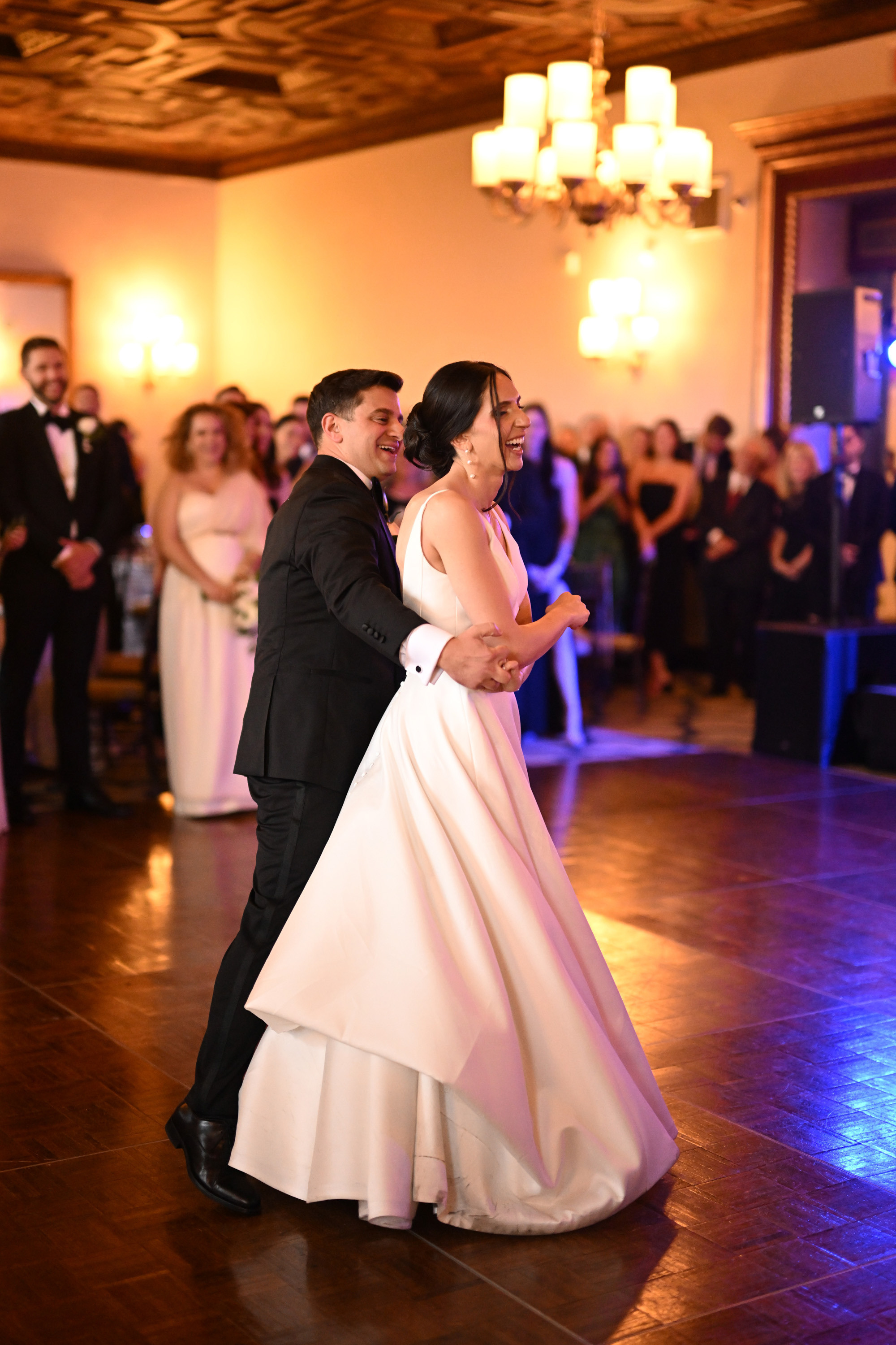 a bride and groom dance at their wedding reception