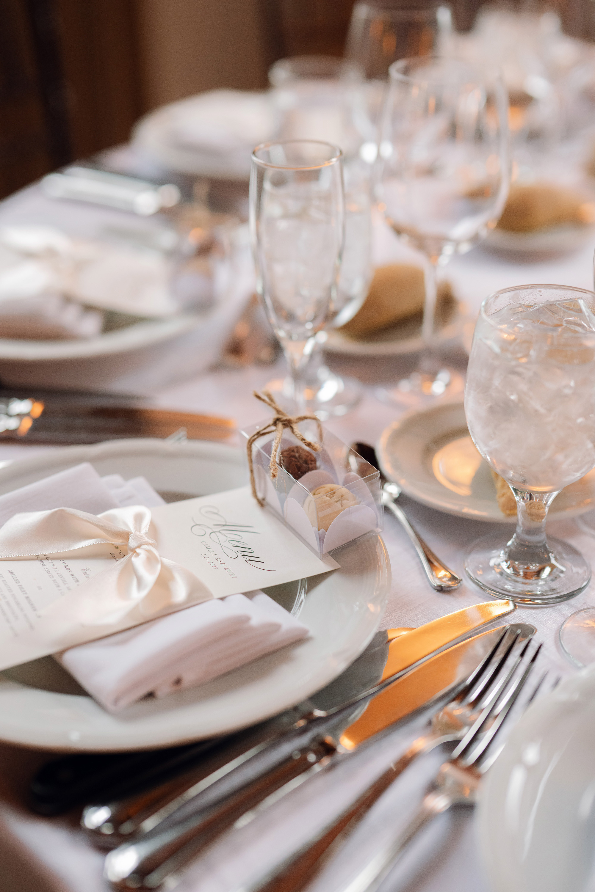 a table with a white table cloth and silverware