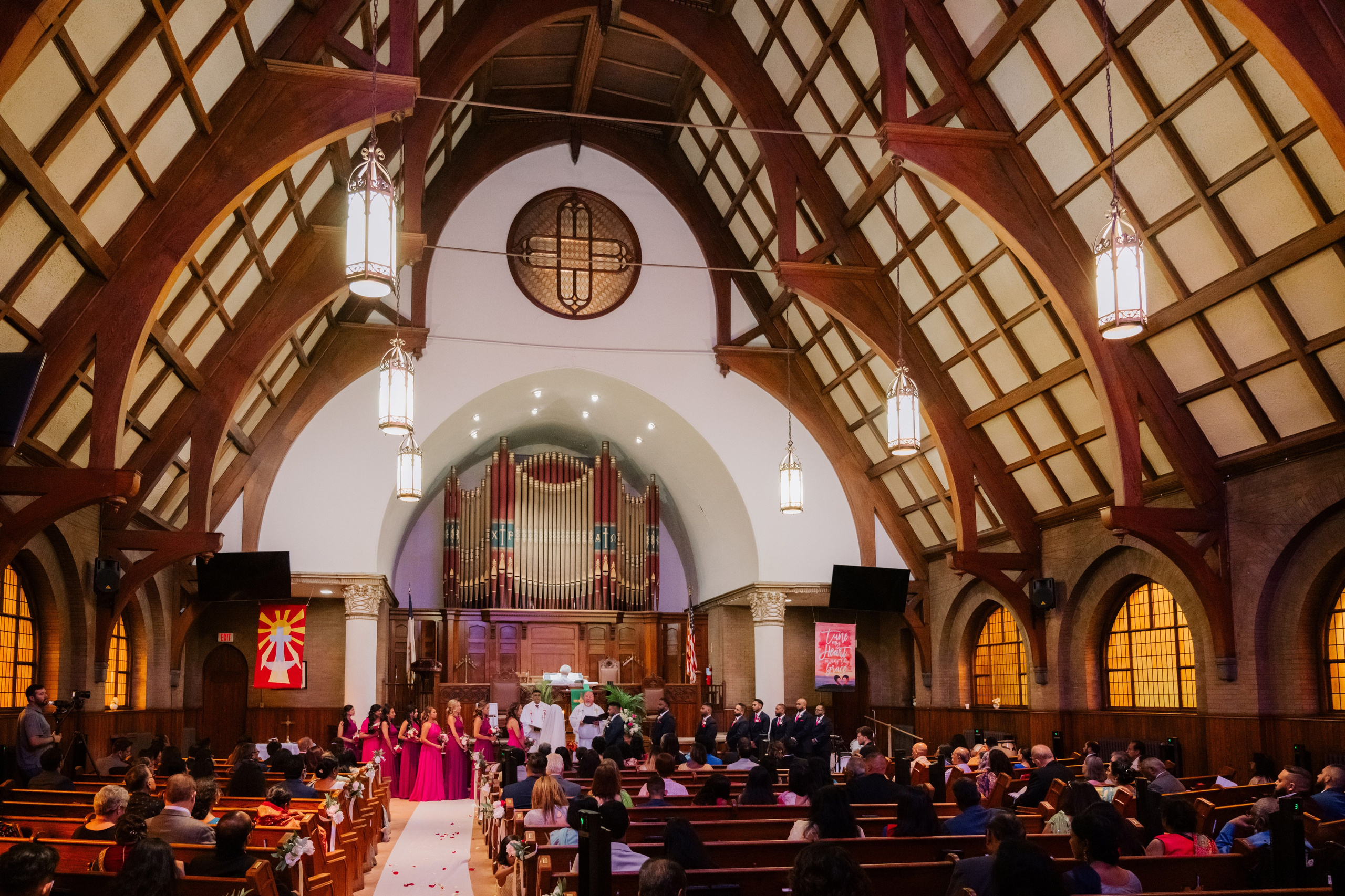 a church filled with people sitting in pew pews