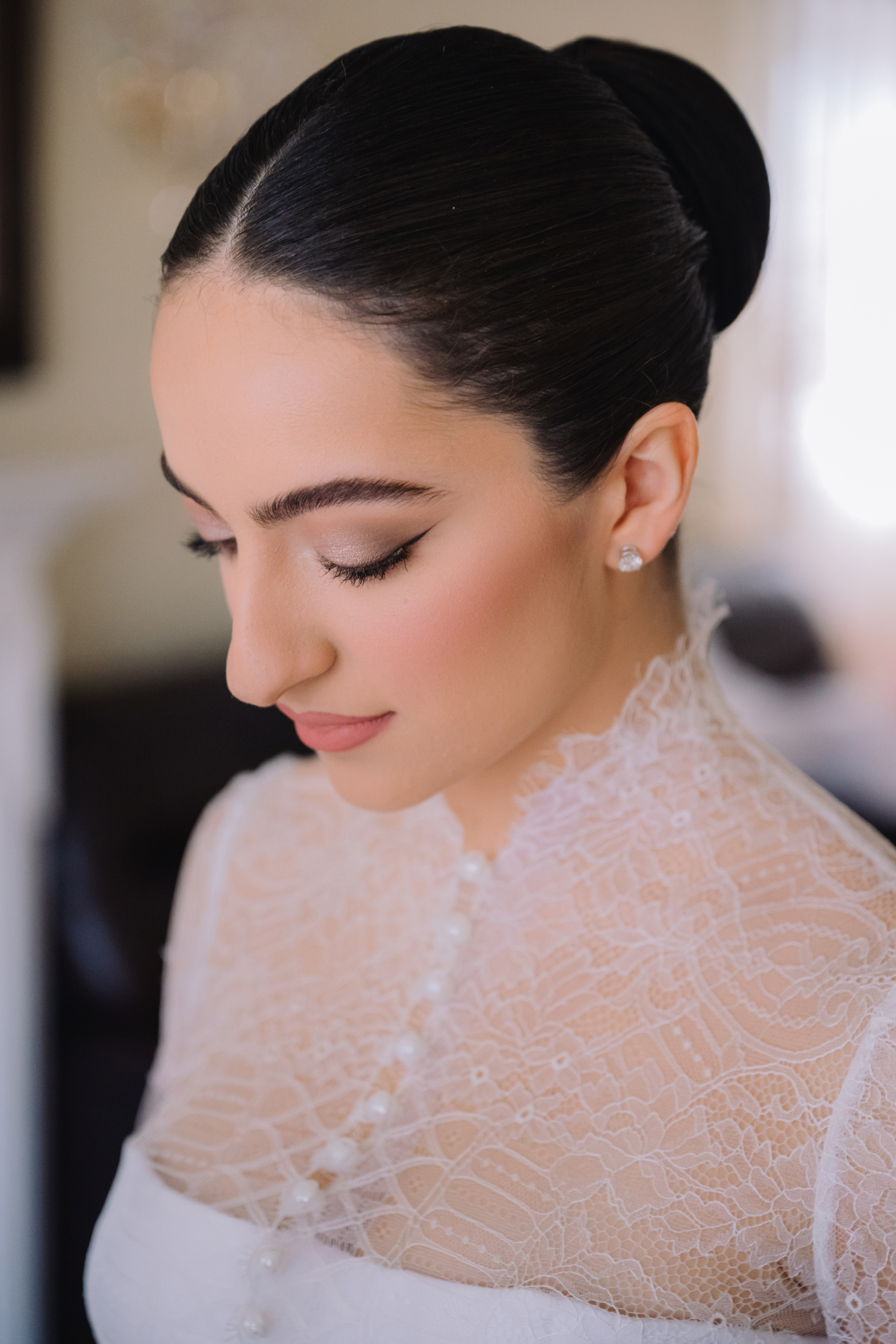 a woman wearing a white dress and a black hair