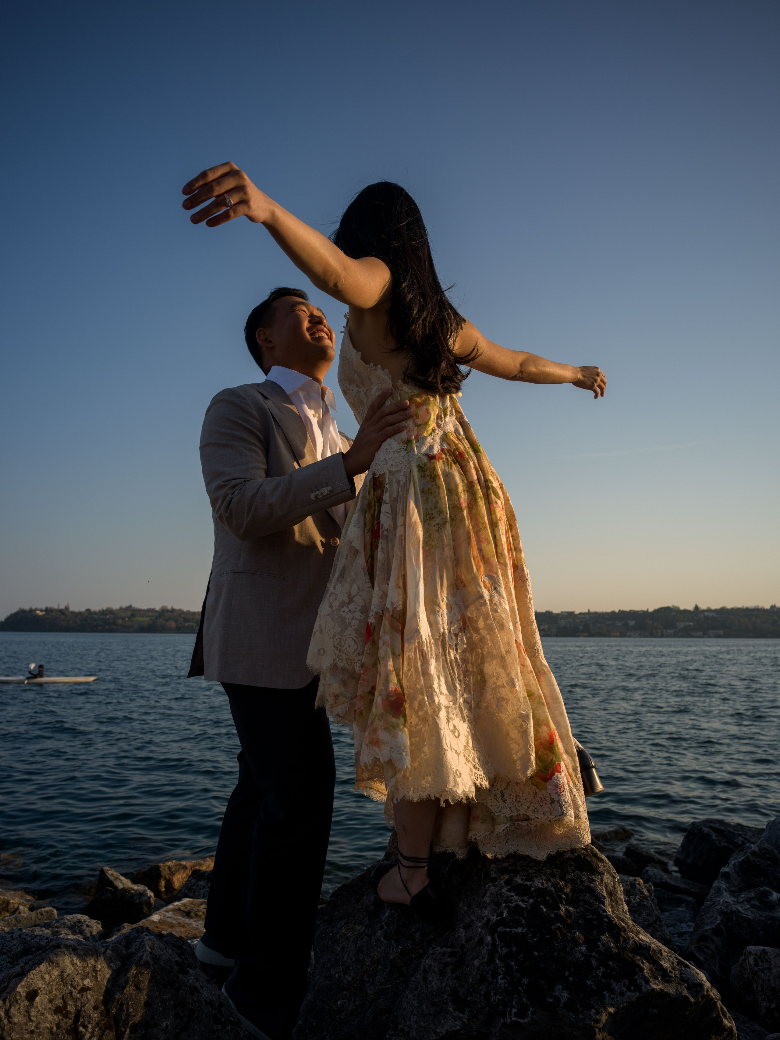 Couple proposal by Lake Garda with Isola del Garda in the background.
