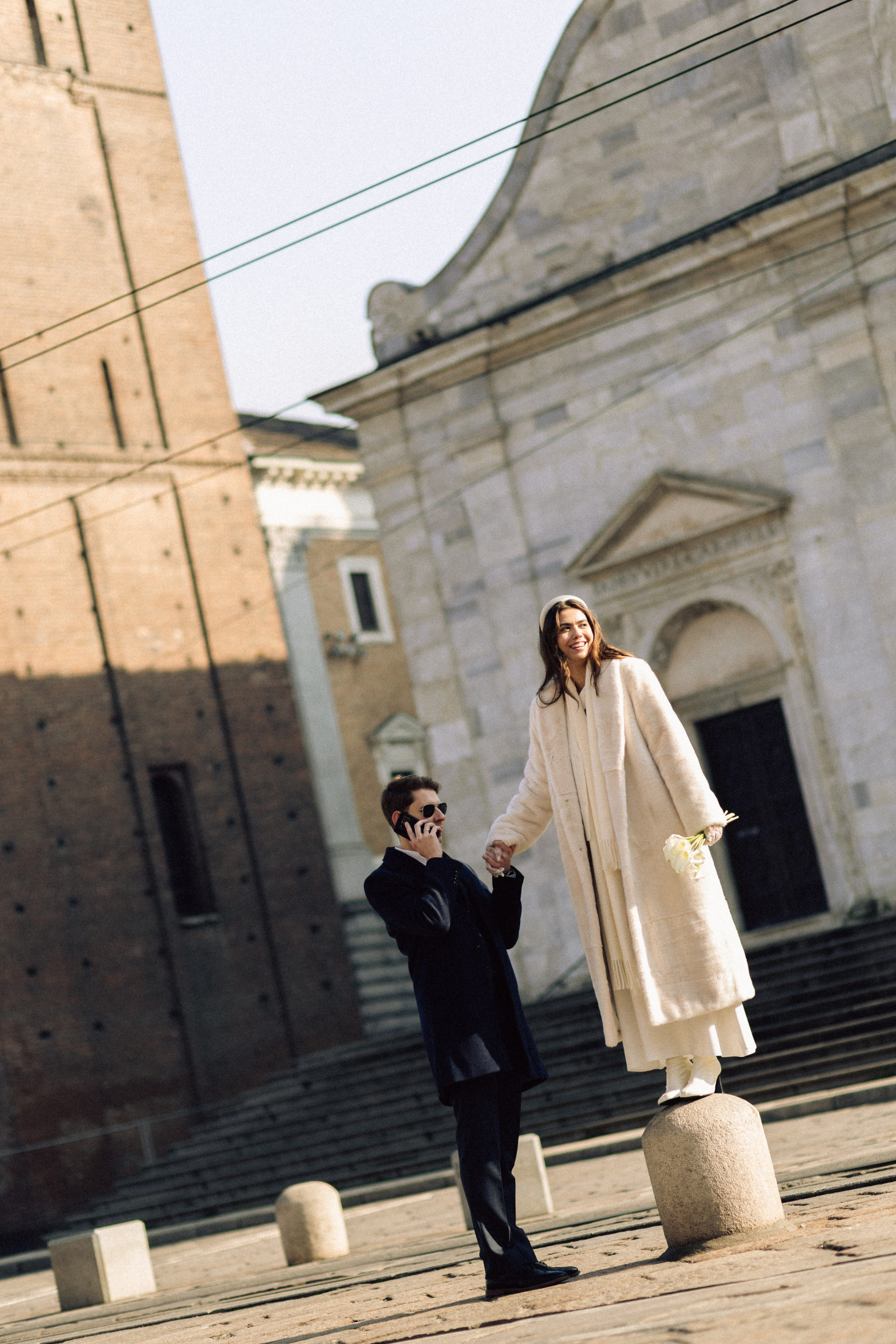 Wedding couple walking through historic streets of Turin