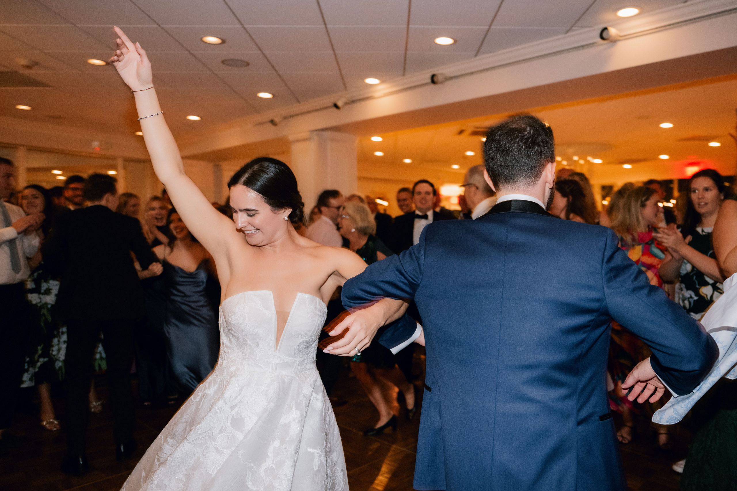 a bride and groom dancing at a wedding reception