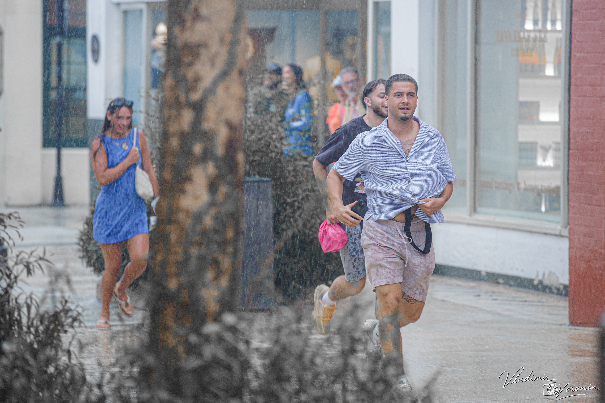 Rain in downtown. Photographer St. Augustine