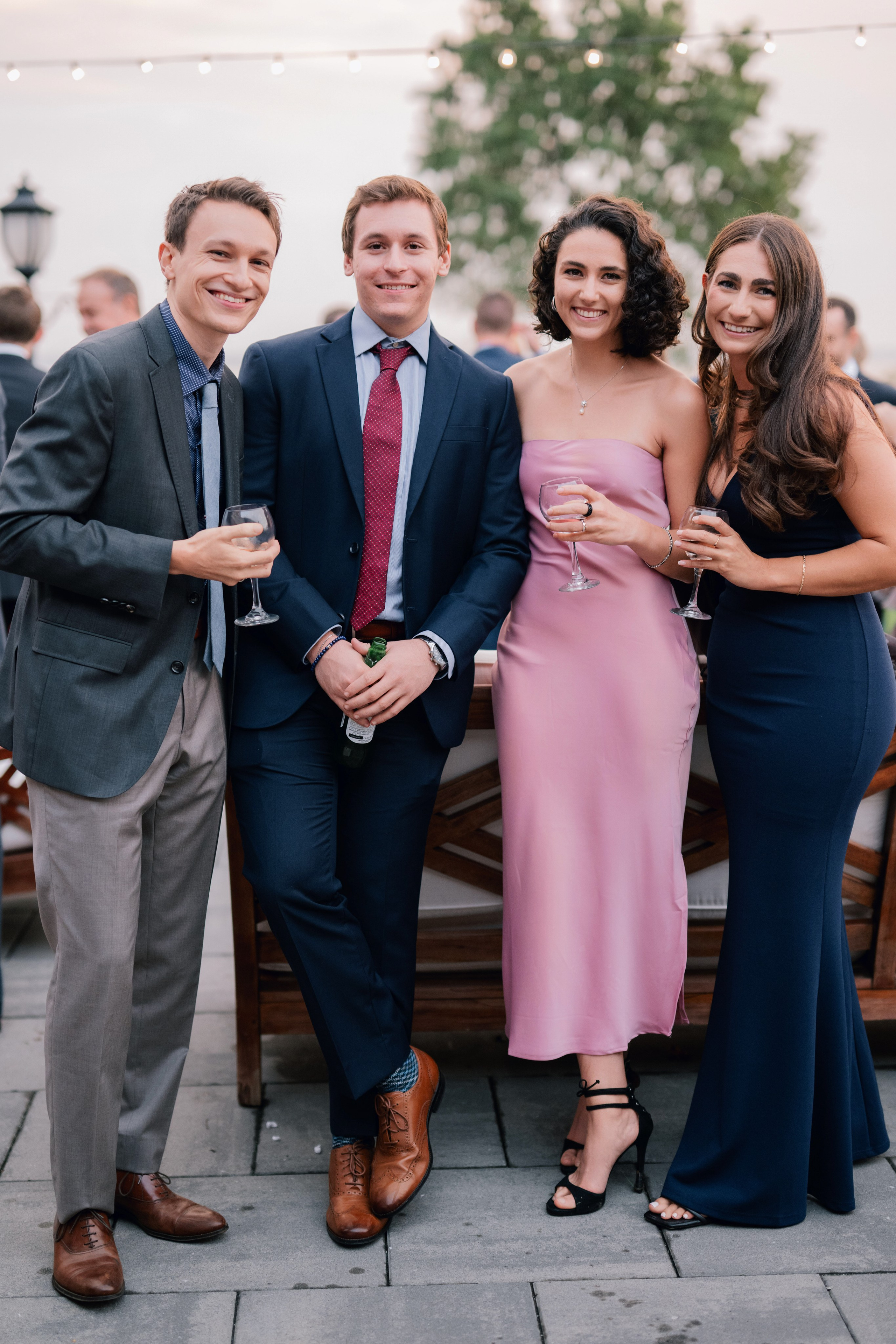 a group of people standing around a table