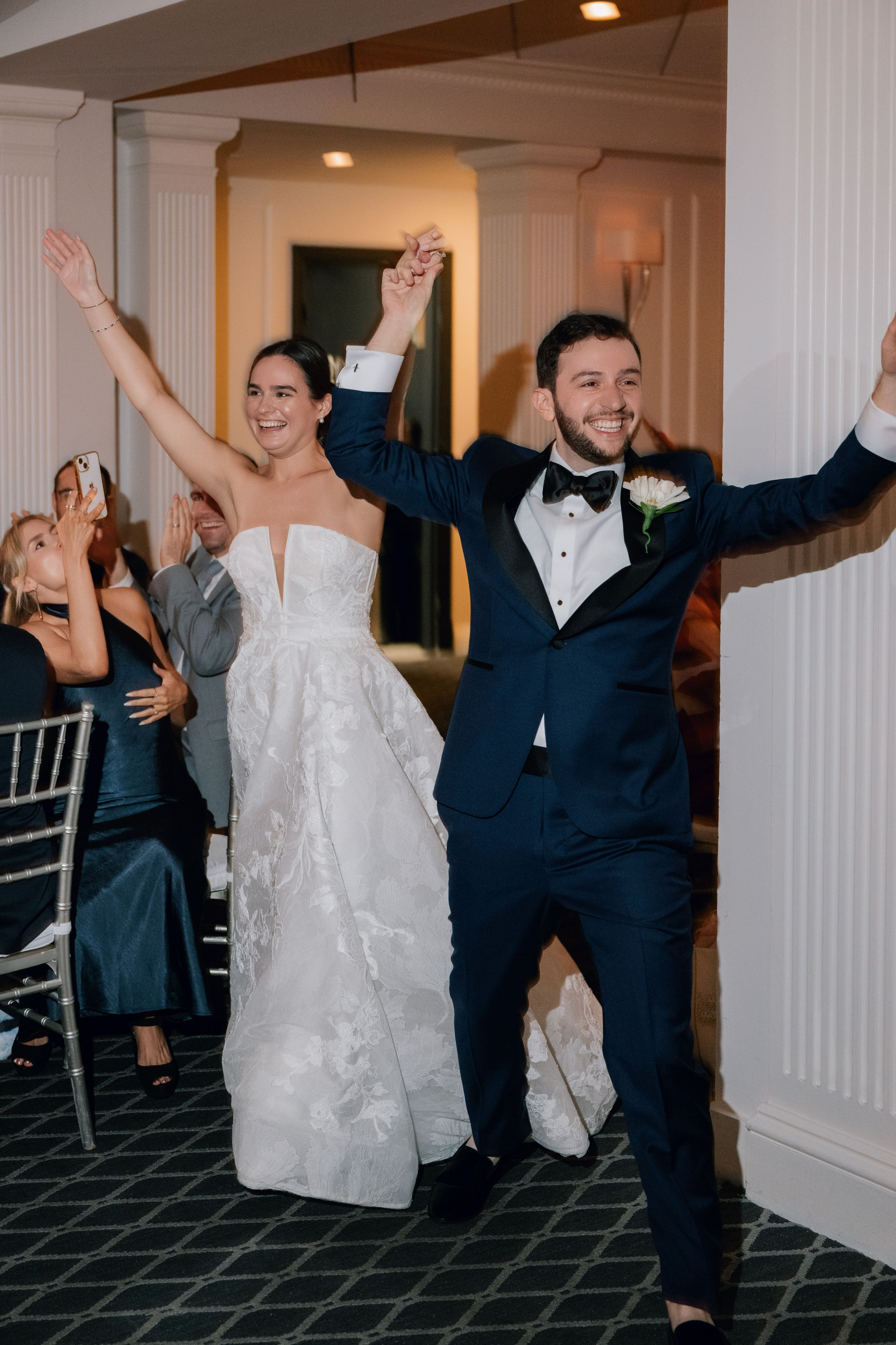 a bride and groom are dancing together