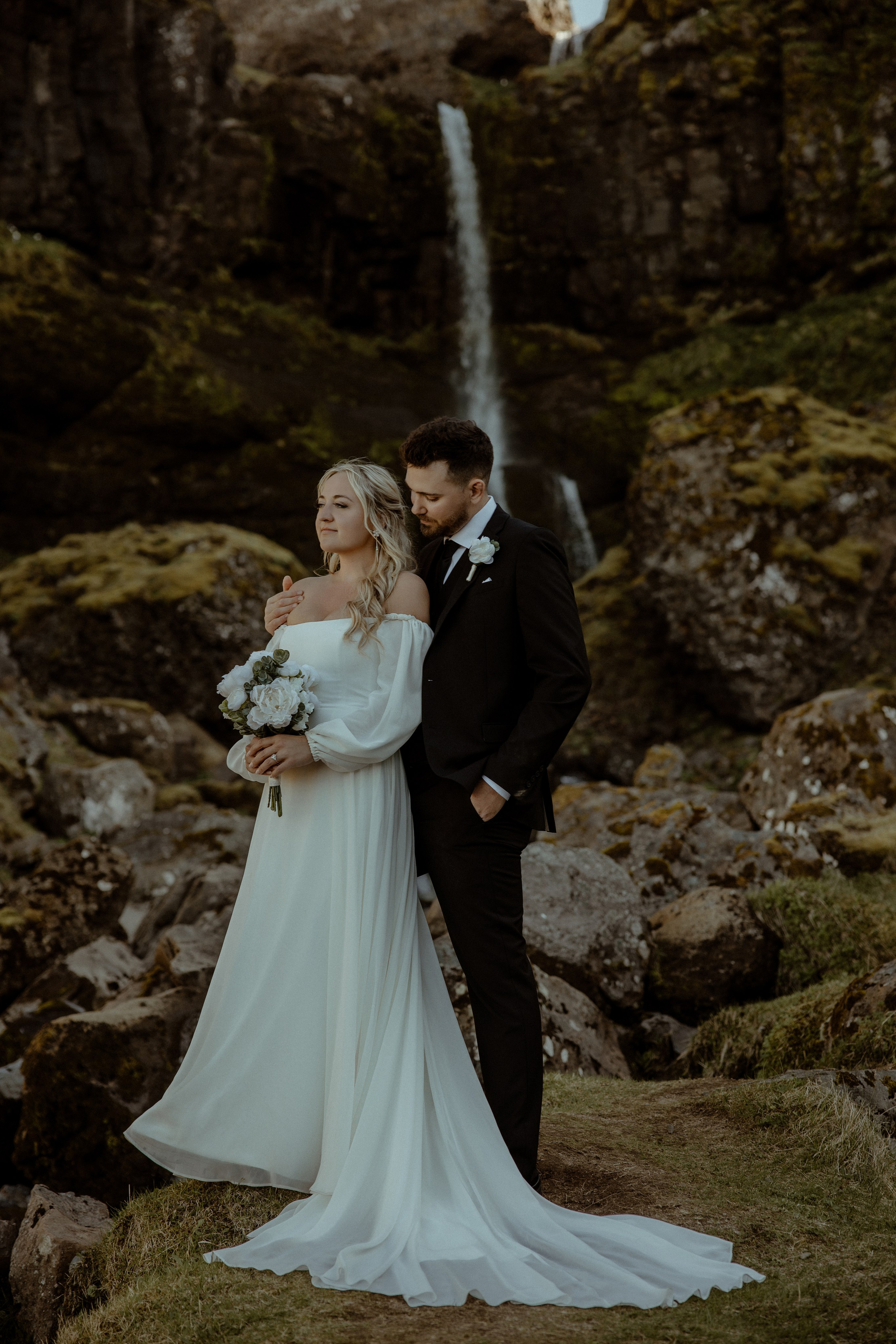 Iceland elopement at Budir with midnight sun wedding photos at black sand beach. Iceland elopement photographer & videographer