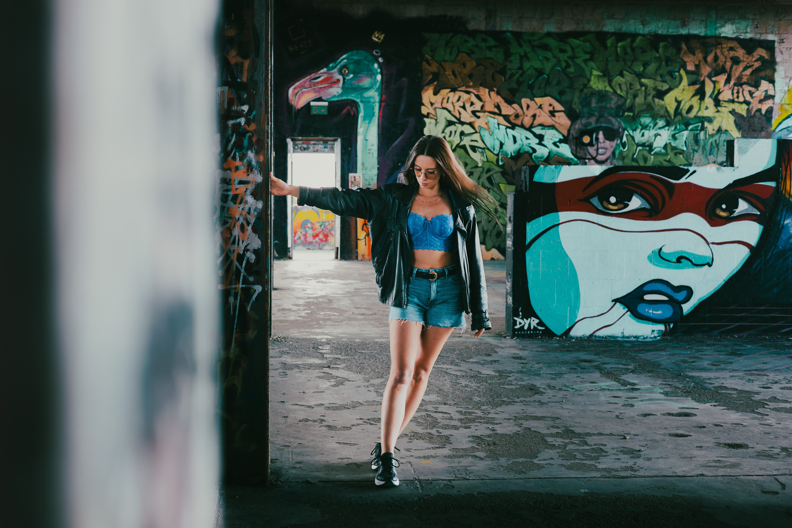 Editorial portrait against the concrete architecture of Teufelsberg