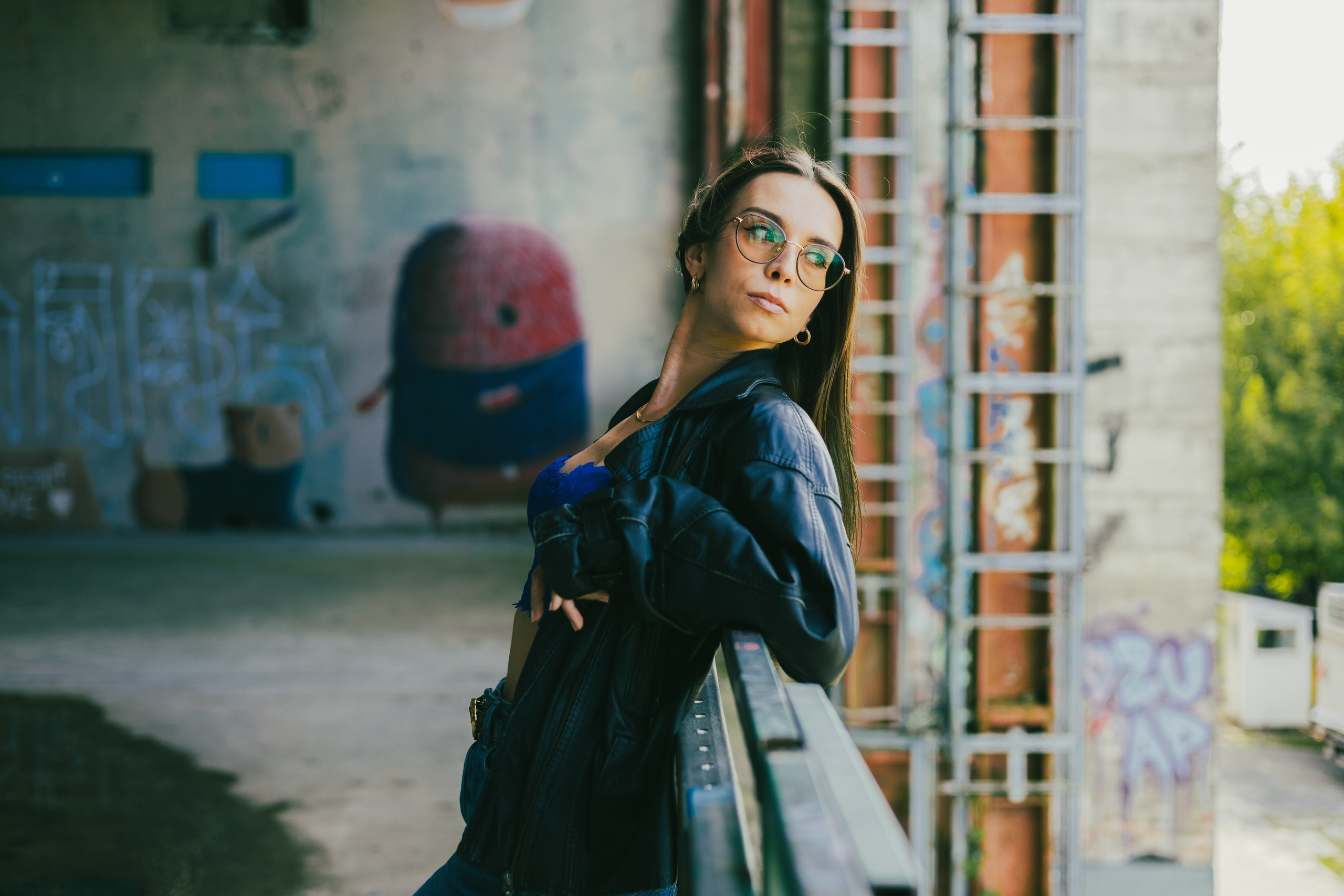 Woman posing in front of street art at Teufelsberg Berlin