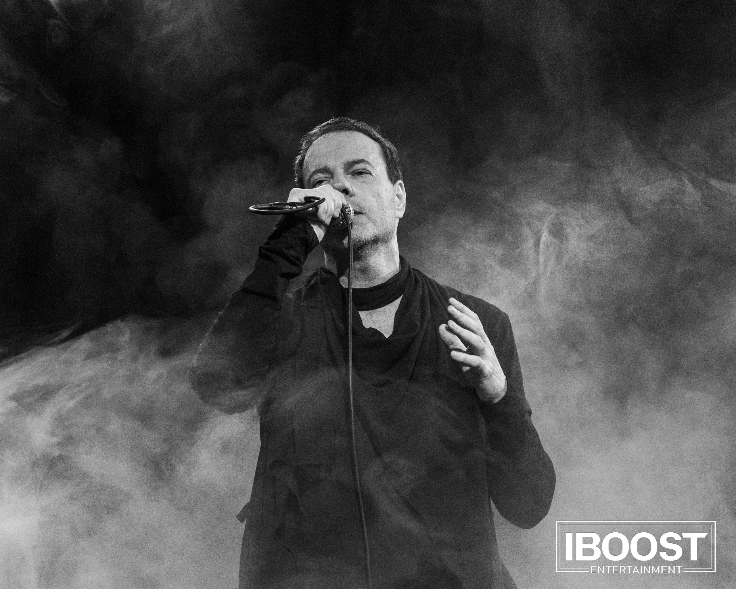 Black-and-white close-up of vocalist Krasovitsky singing on stage surrounded by concert smoke during the Animal JazZ show in Sofia.
