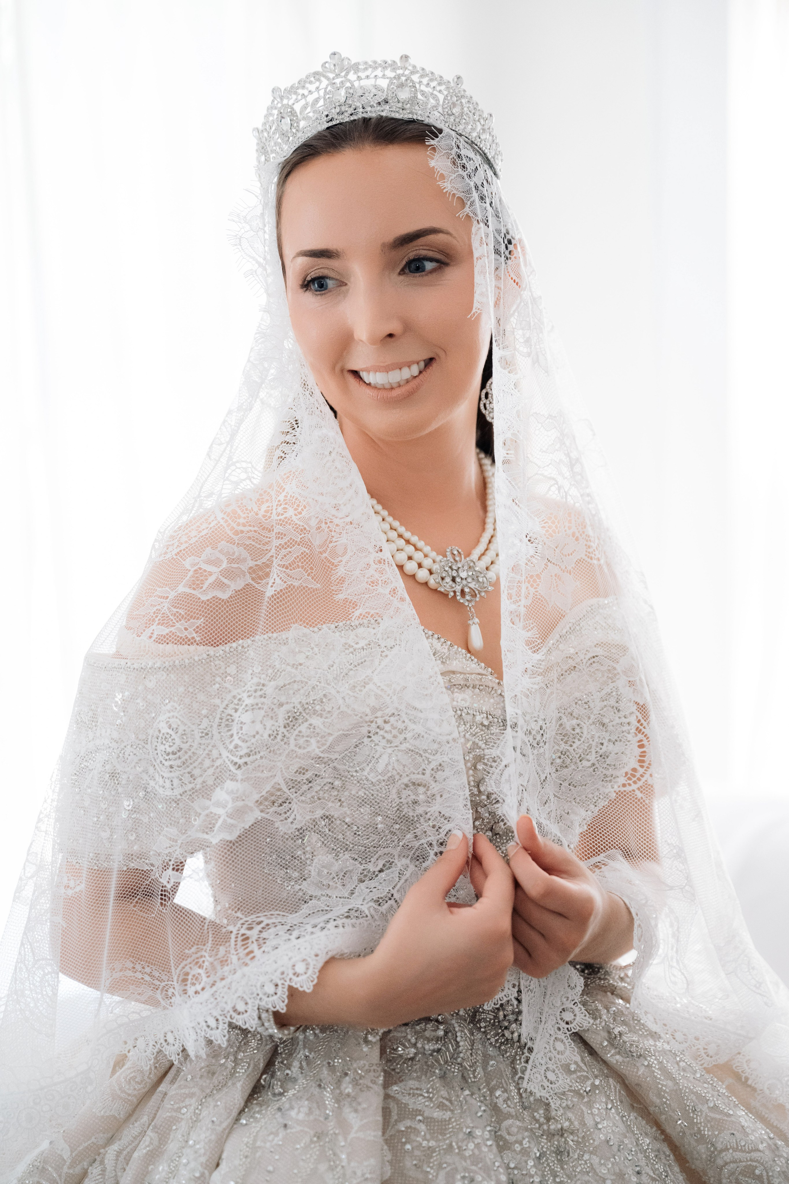 a woman in a wedding dress and veil