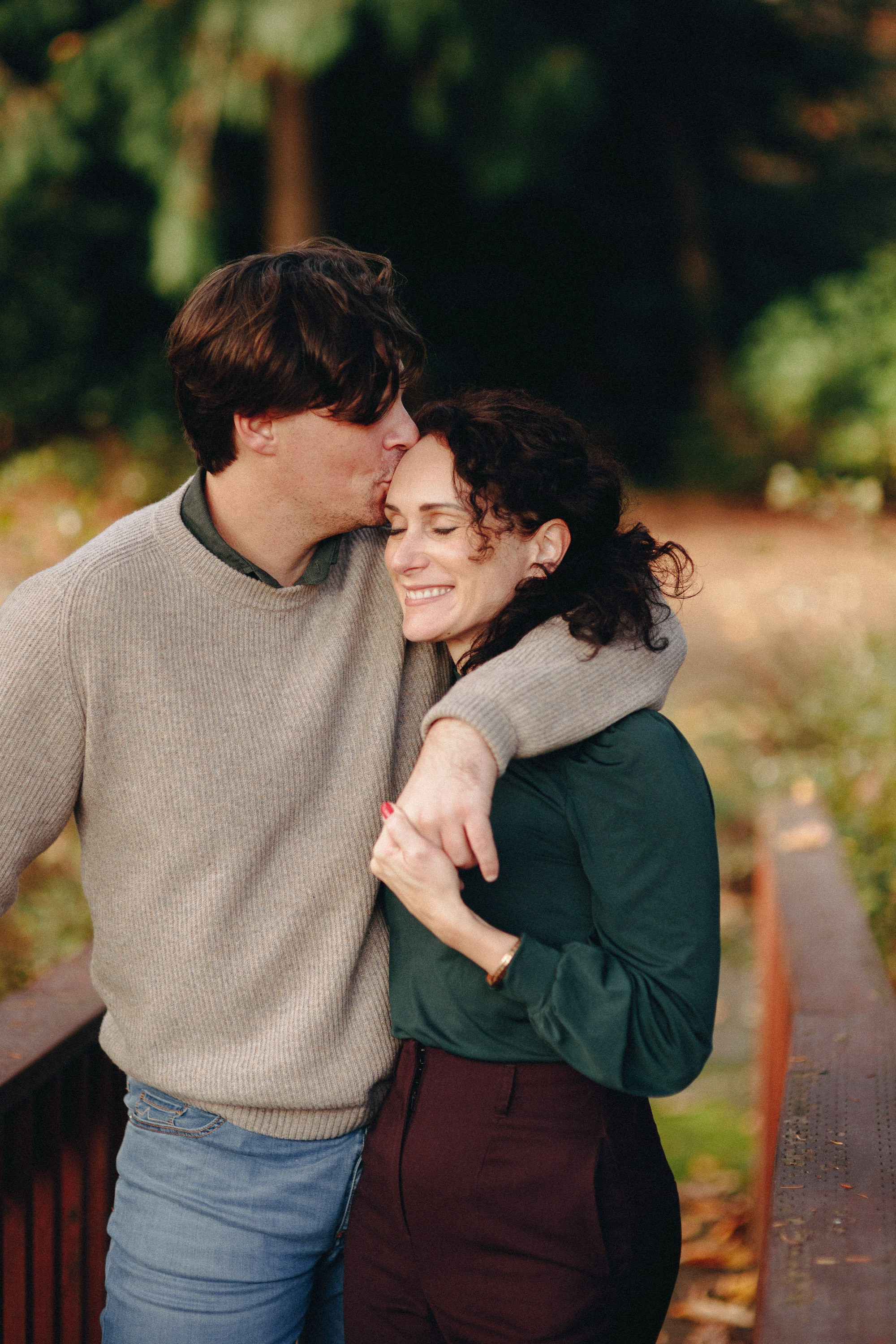 Couple hugging and laughing outdoors