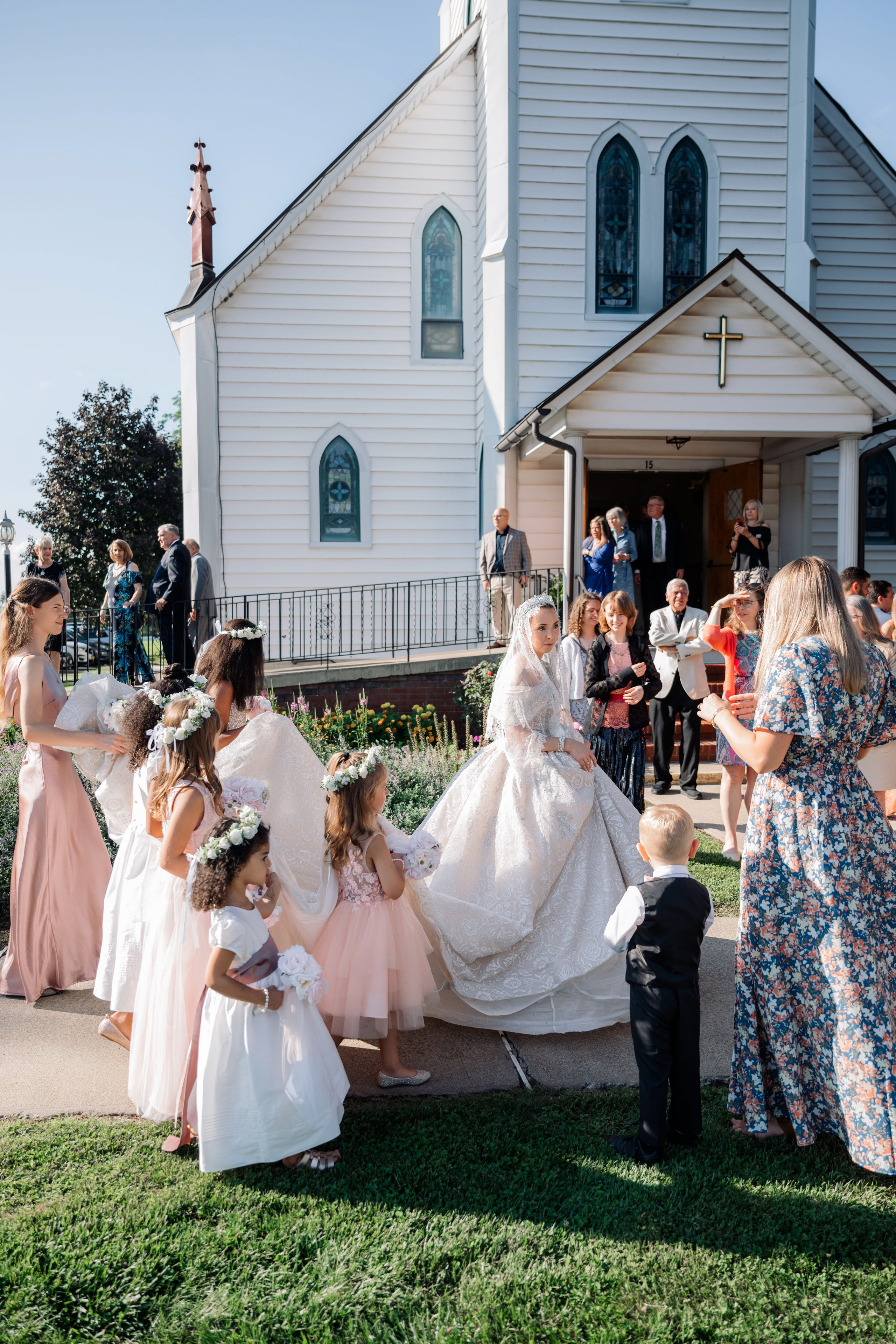 a group of people standing around a small child