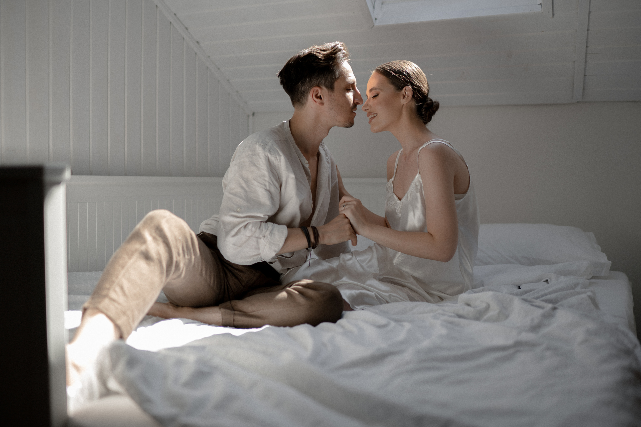 Heartwarming moments shared in bed by the couple on their wedding morning, basking in love and anticipation for their joyous celebration.