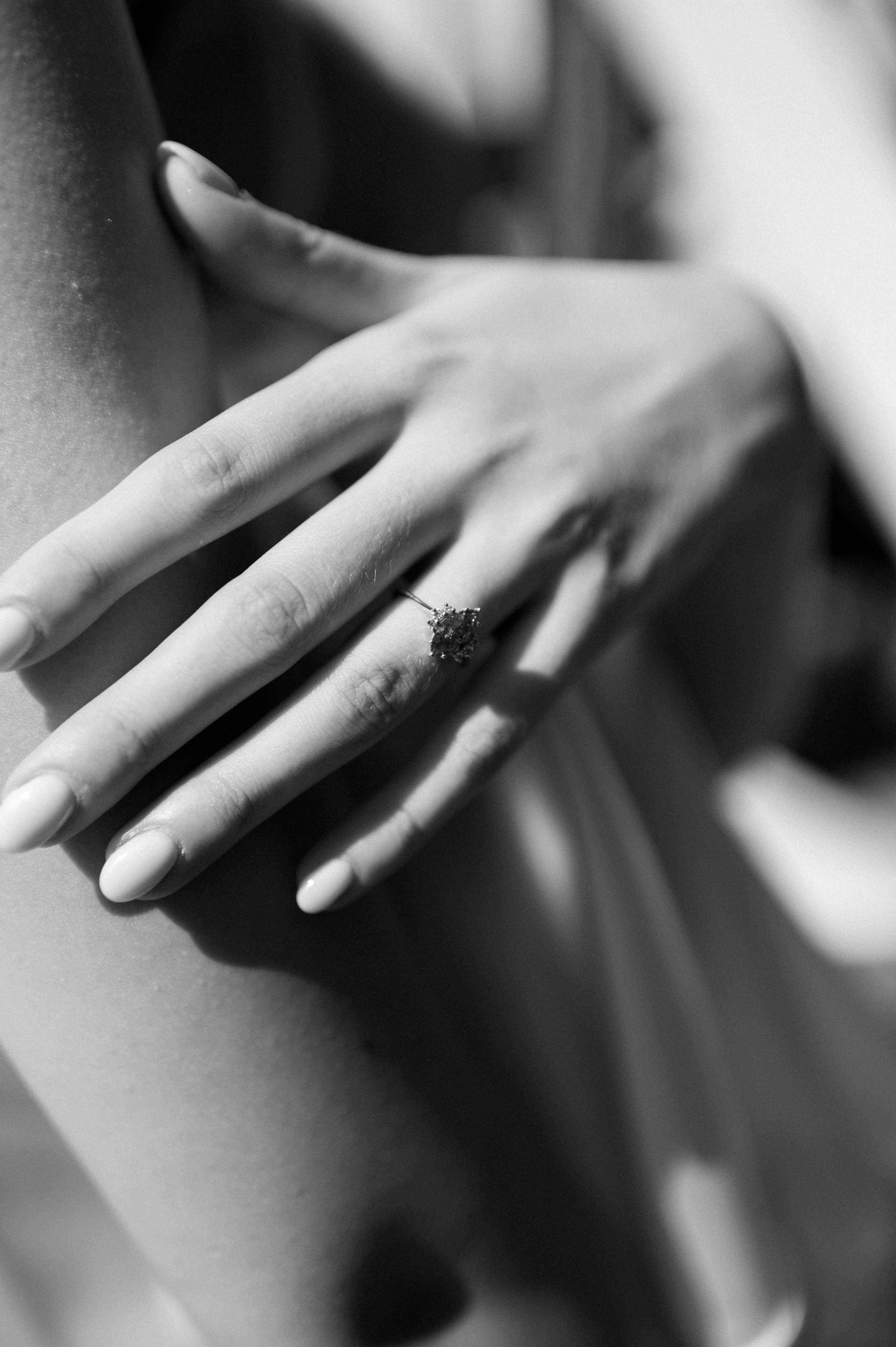 The delicate bride's satin dress whispers of elegance and sophistication, a perfect reflection of her style and grace on the enchanting wedding morning.