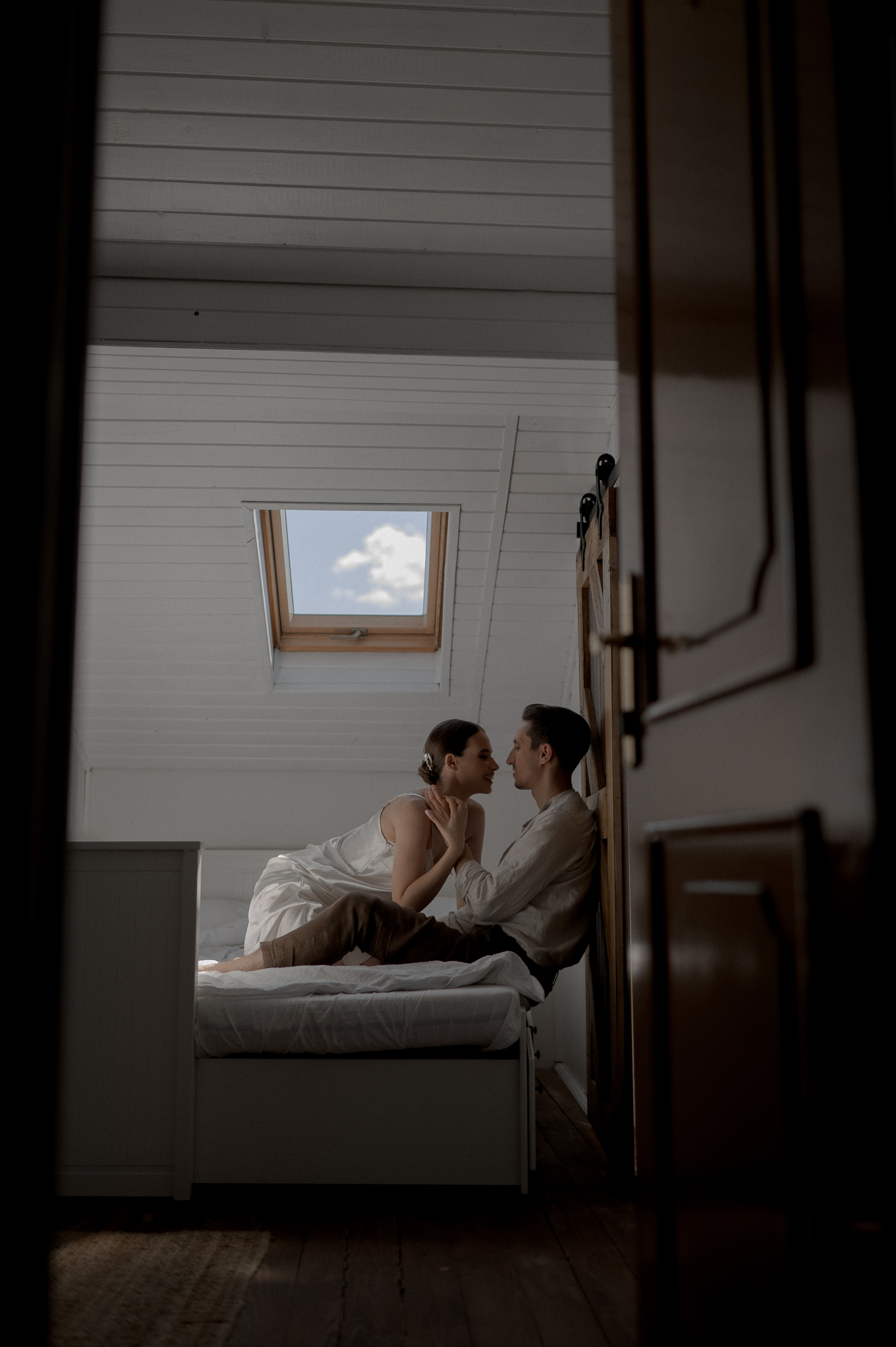 Cozy morning intimacy shared by the couple, celebrating love and eagerly awaiting the festivities of their wedding day.