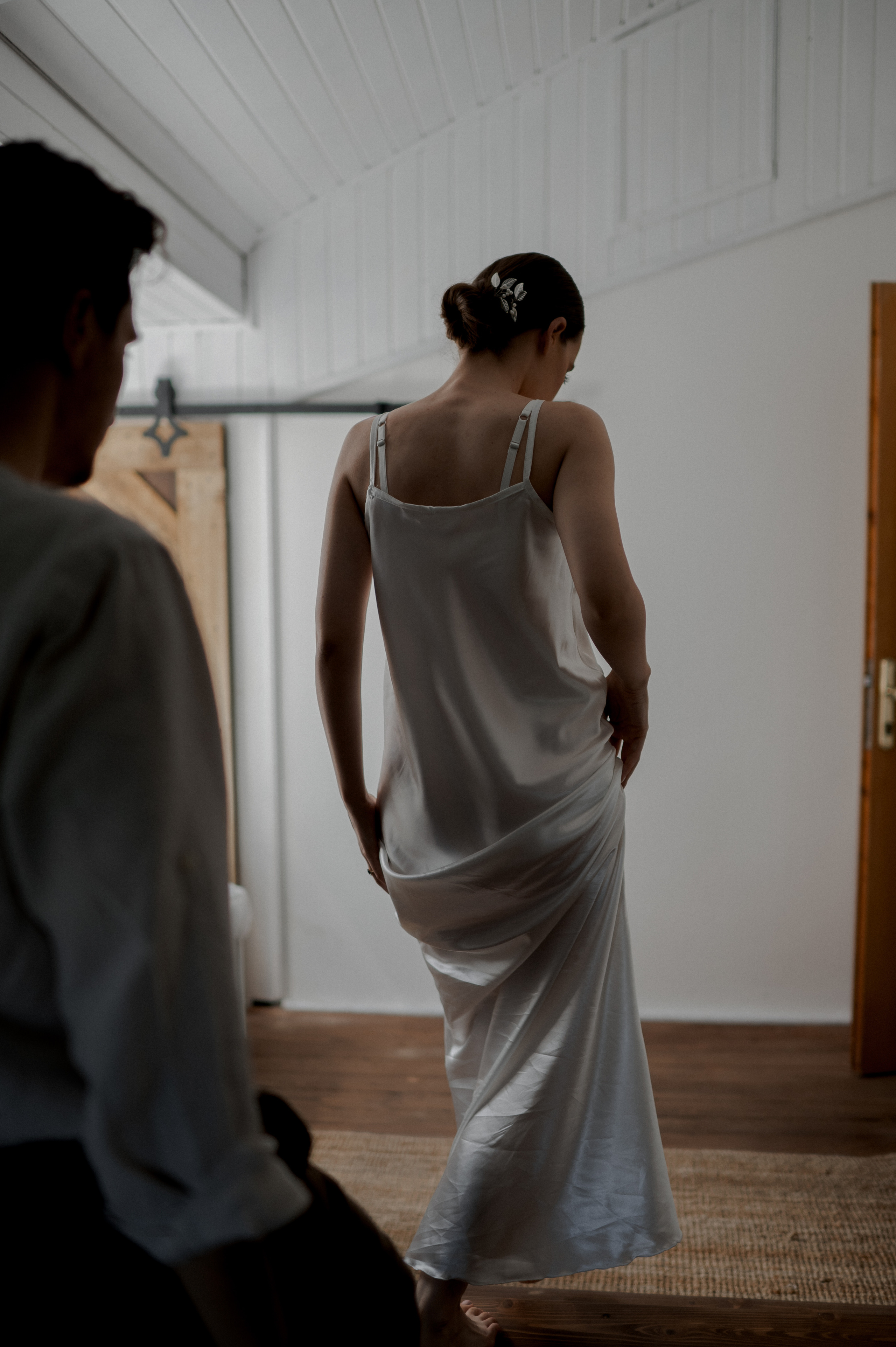 Nestled in a secluded retreat, the couple embraces the intimacy of their wedding morning. a sanctuary where their love flourishes, promising a lifetime of happiness.