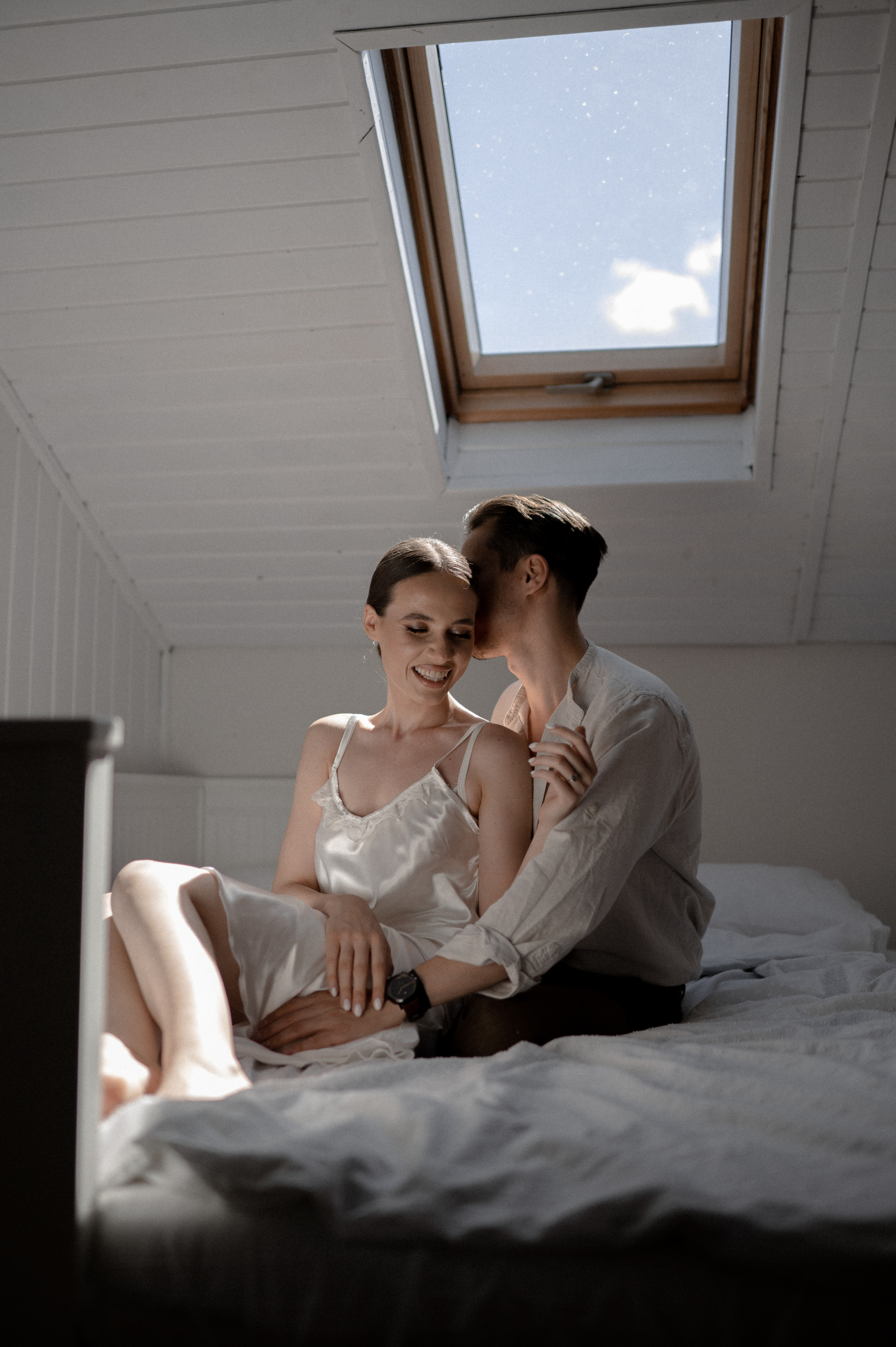 Tender moments shared by the couple in bed on their wedding morning, embracing love and anticipation as they embark on their new chapter.